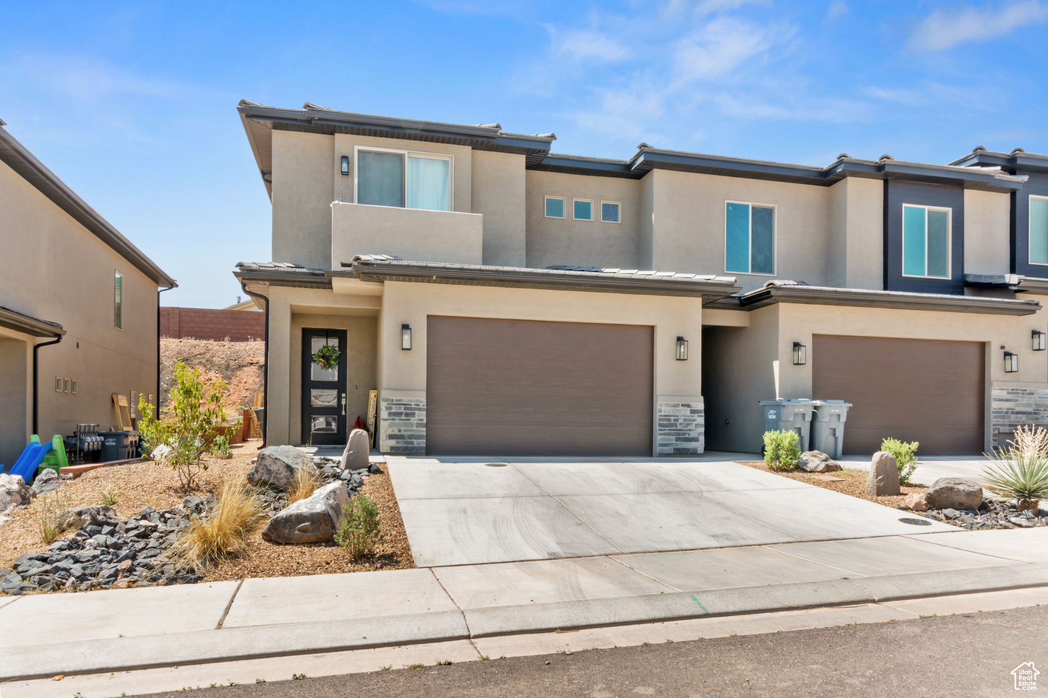 View of front of property featuring a garage