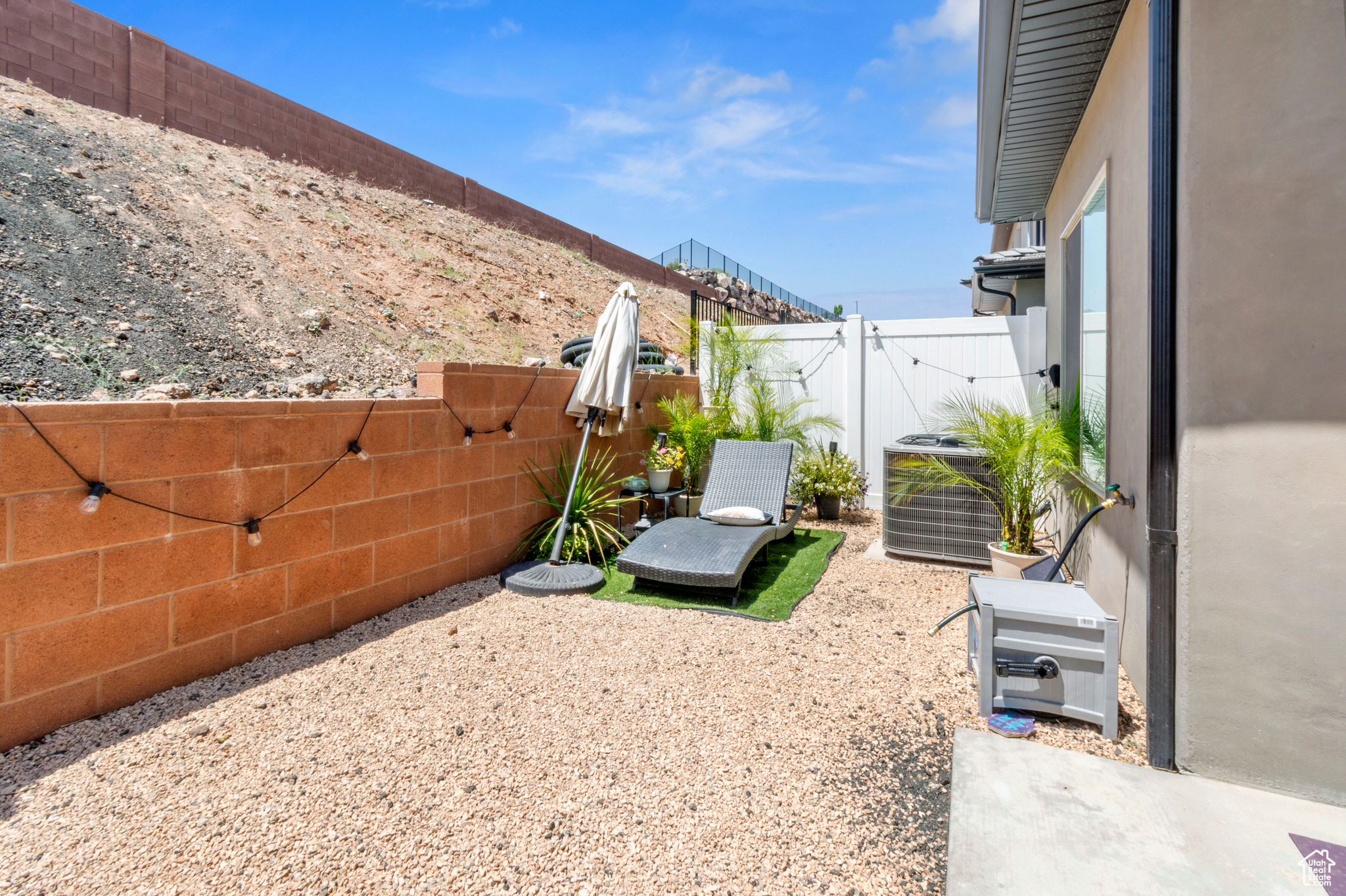 View of yard with central AC unit