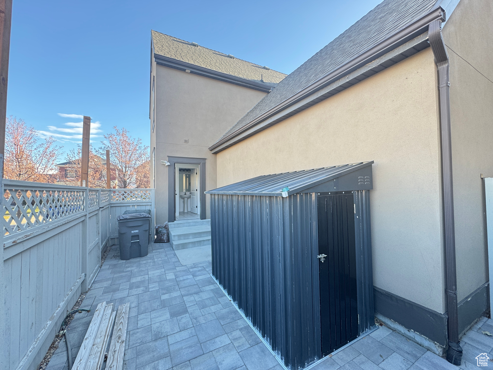 View of side of home with a patio