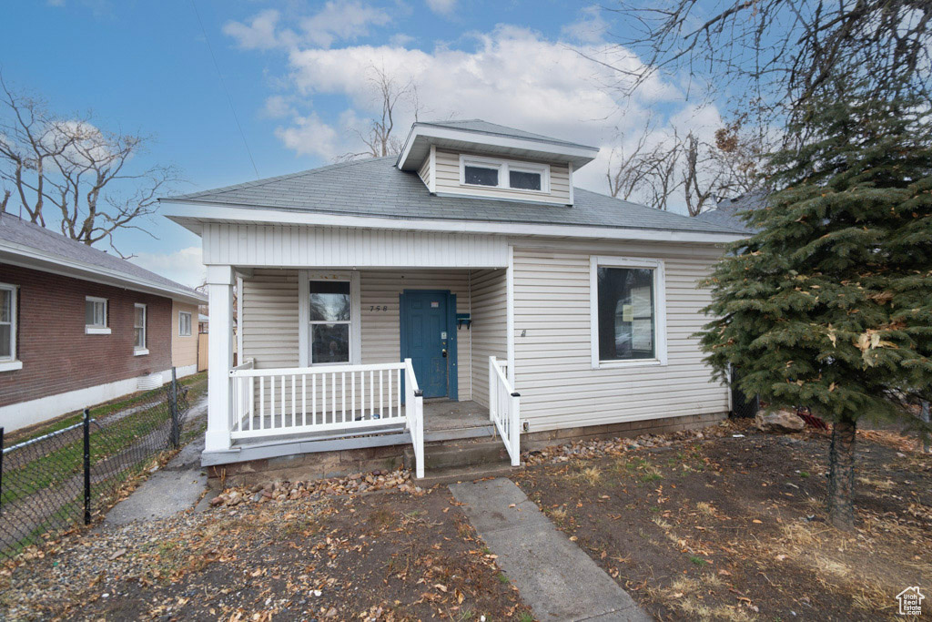 Bungalow featuring covered porch