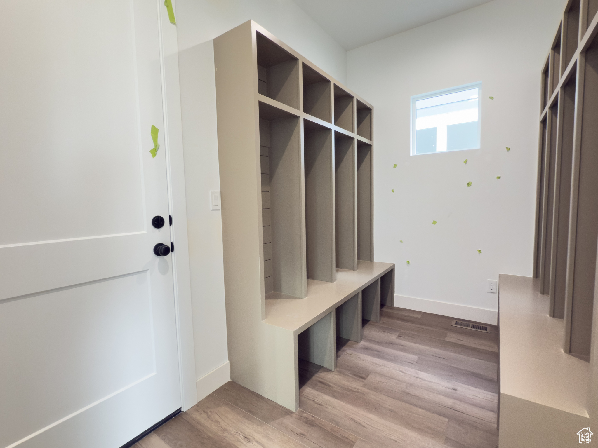 Mudroom with light wood-type flooring