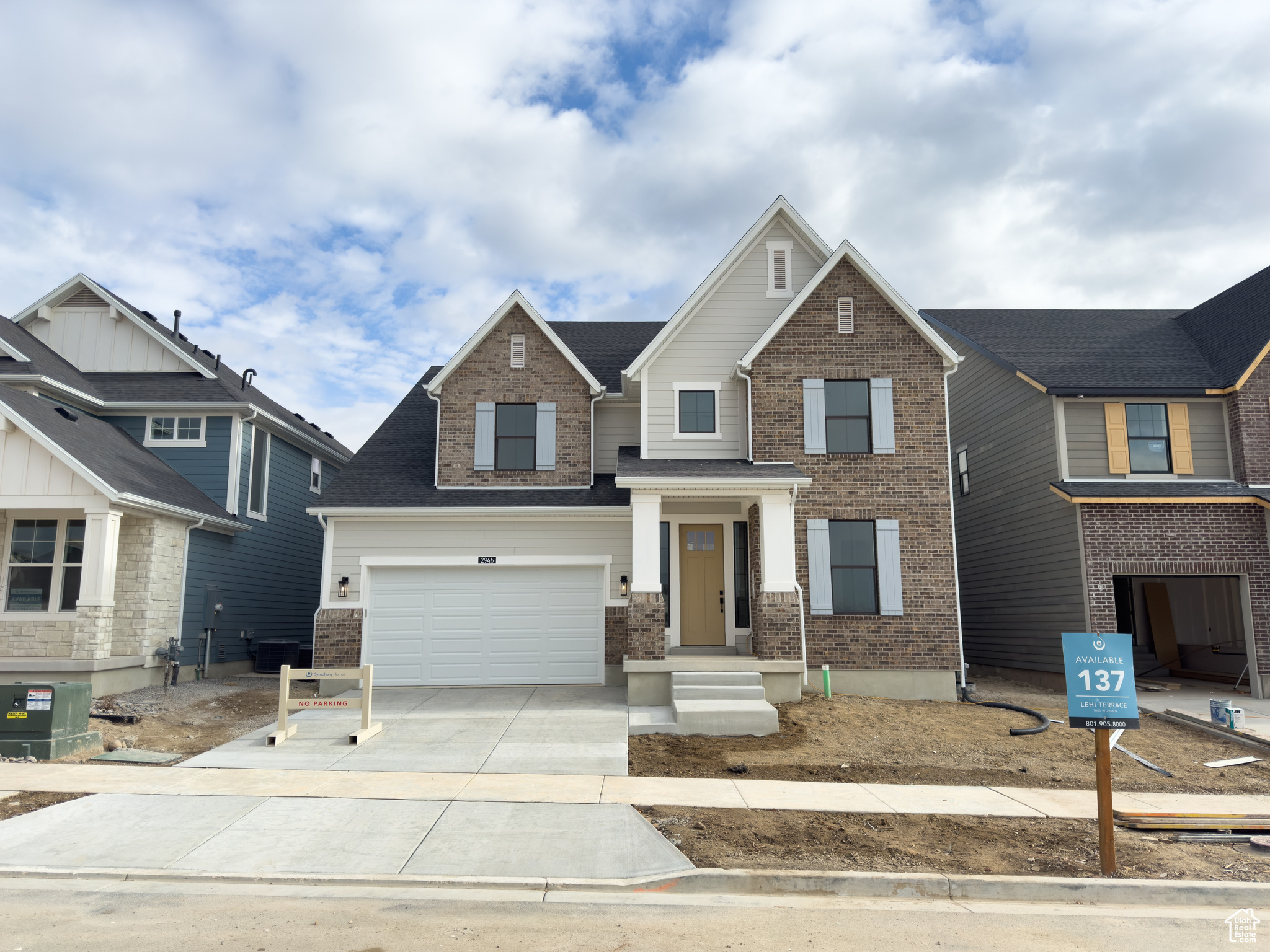 Craftsman-style house with a garage and central air condition unit