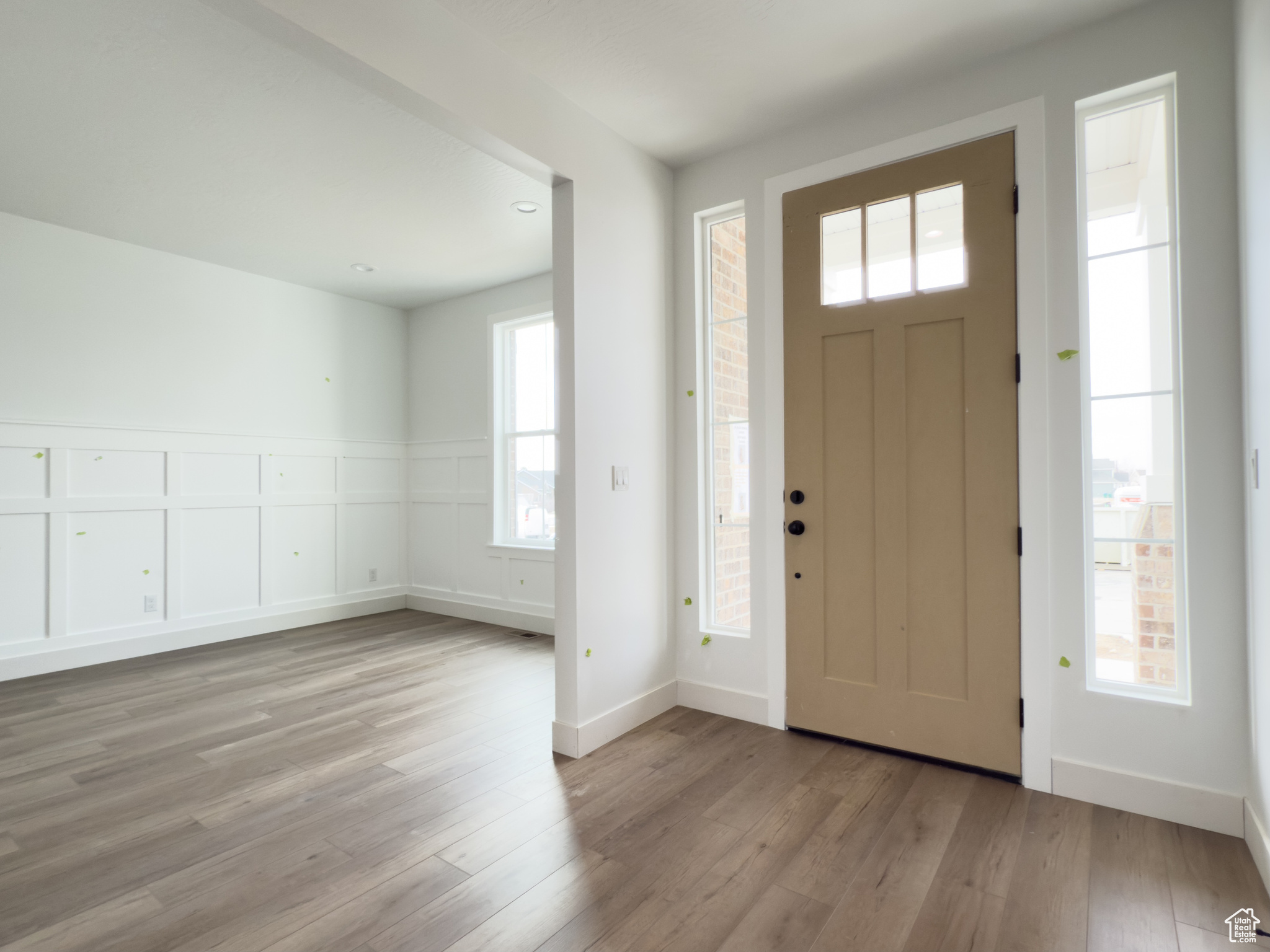 Entrance foyer with light hardwood / wood-style flooring