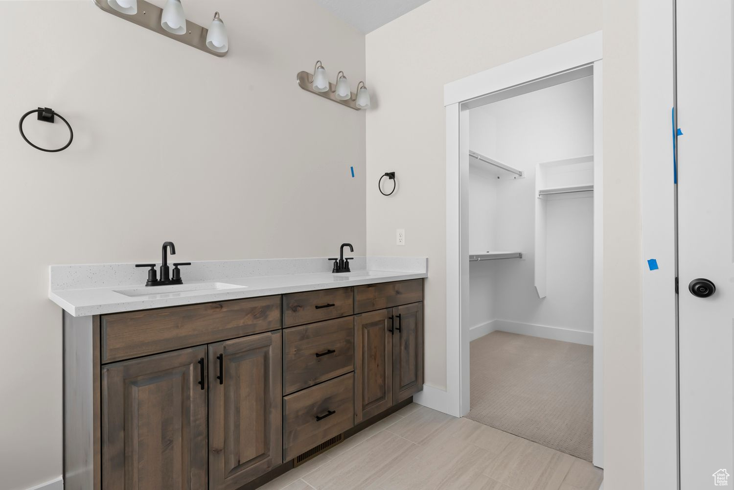 Bathroom featuring vanity and tile patterned floors