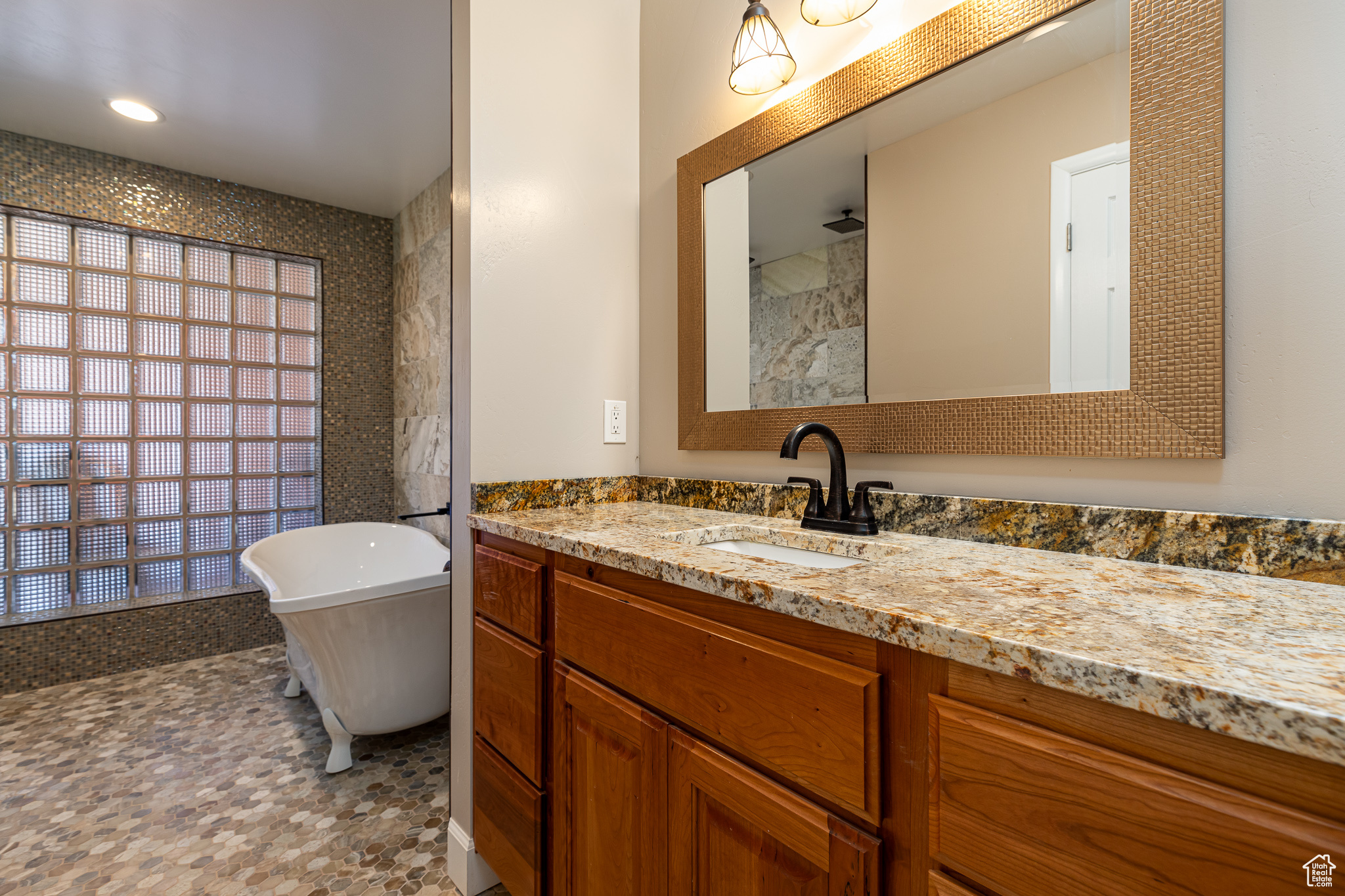 Master bedroom #1 Bathroom featuring vanity and a bathtub