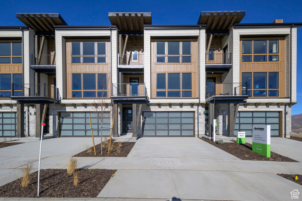 View of front of home featuring a garage