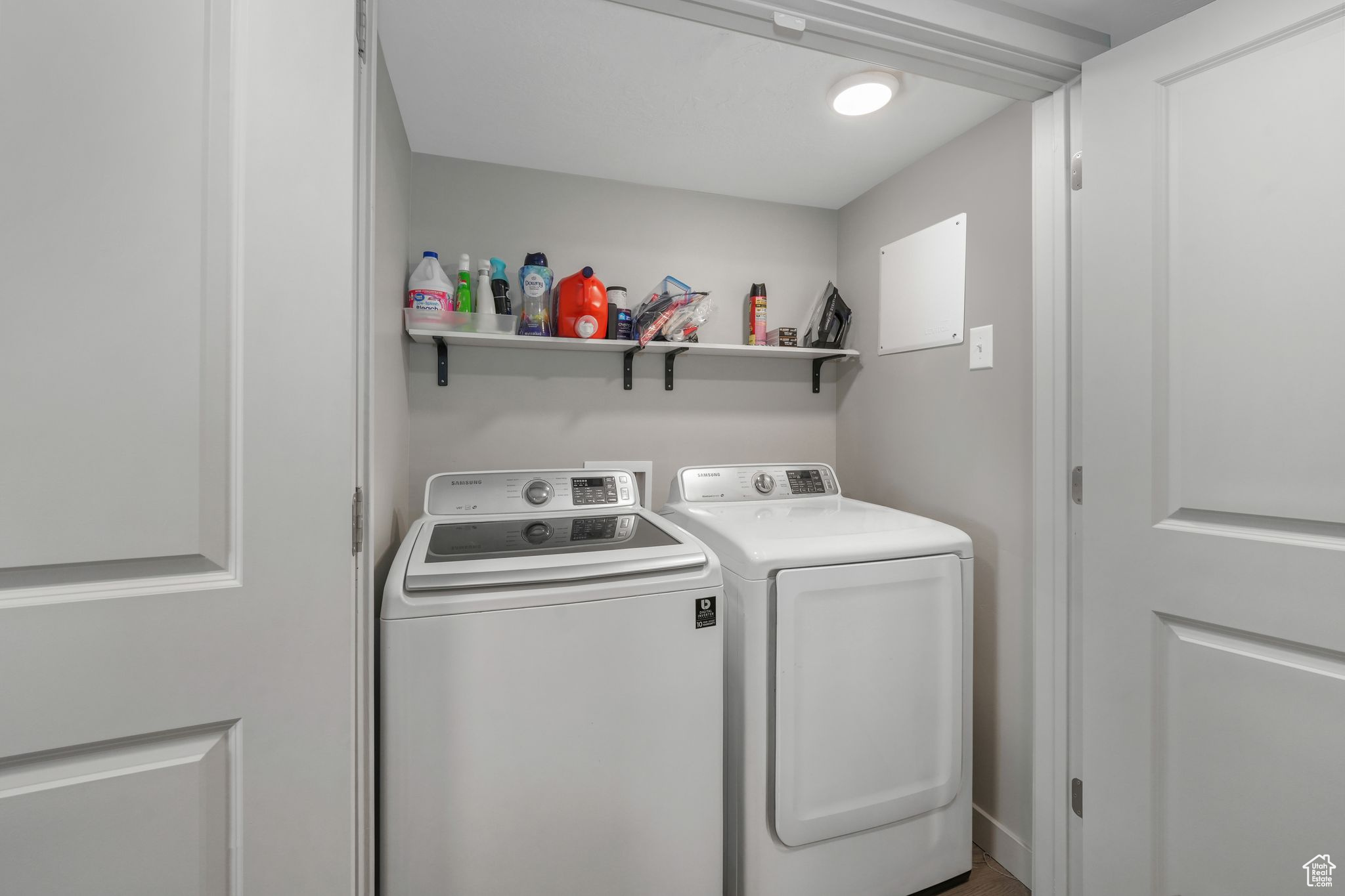 Washroom featuring separate washer and dryer