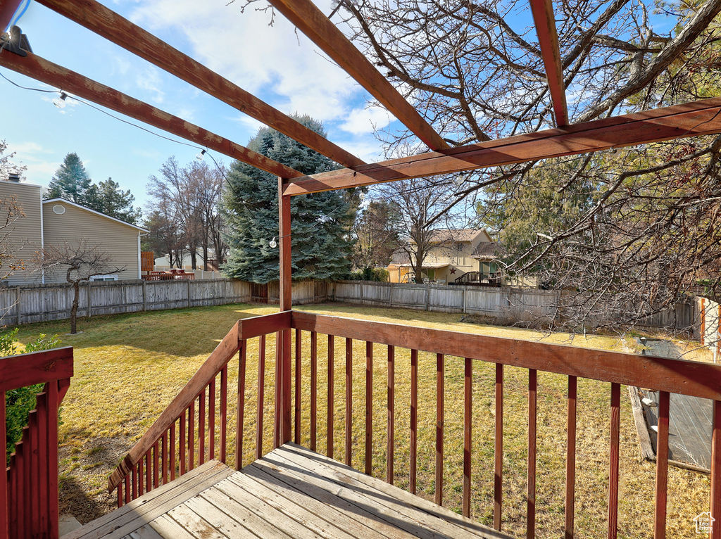 Wooden terrace with a lawn