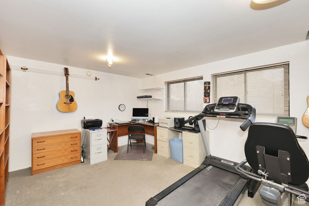 Exercise room with light carpet