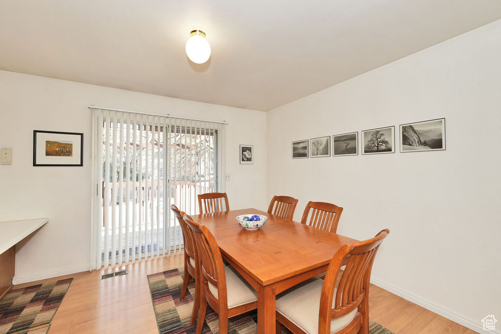 Dining area with light wood-type flooring