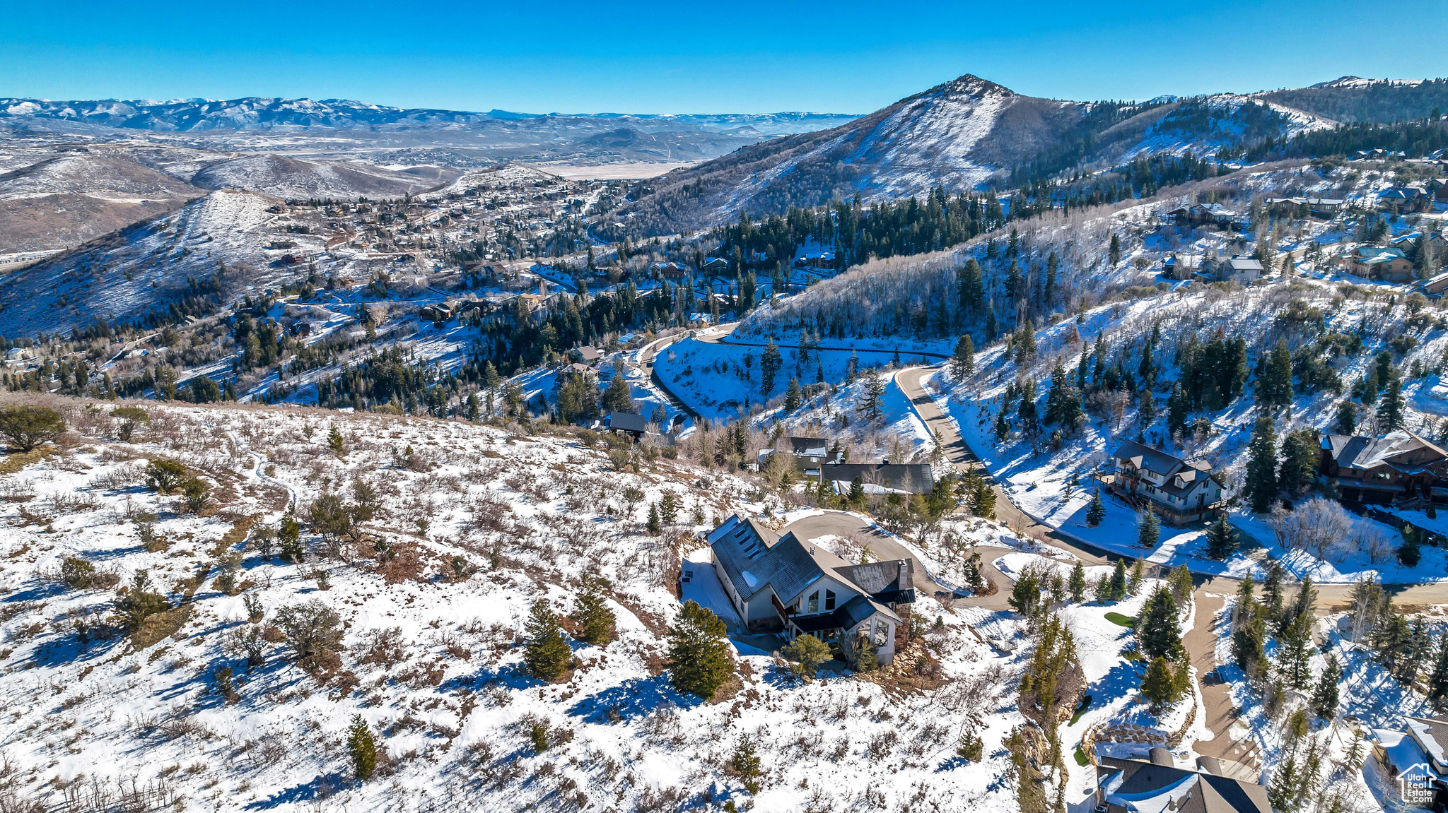 Snowy aerial view featuring a mountain view