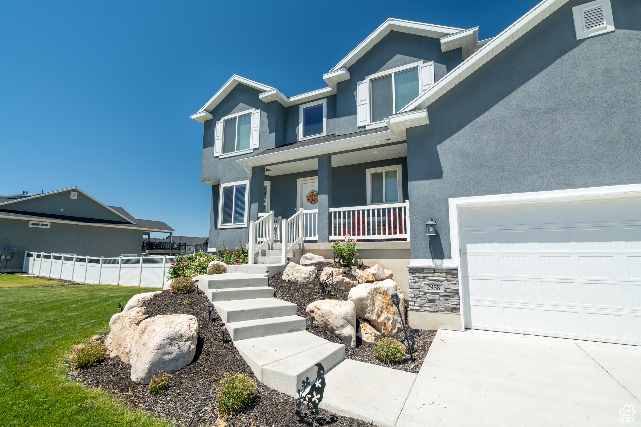 Craftsman inspired home featuring a porch and a garage