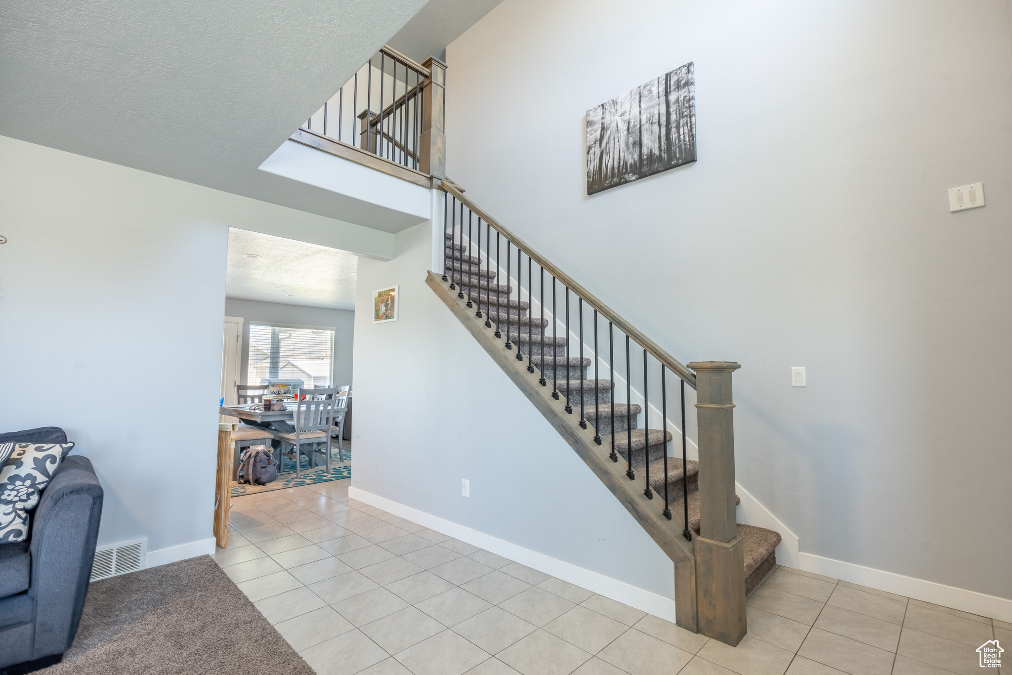 Stairs featuring tile patterned flooring