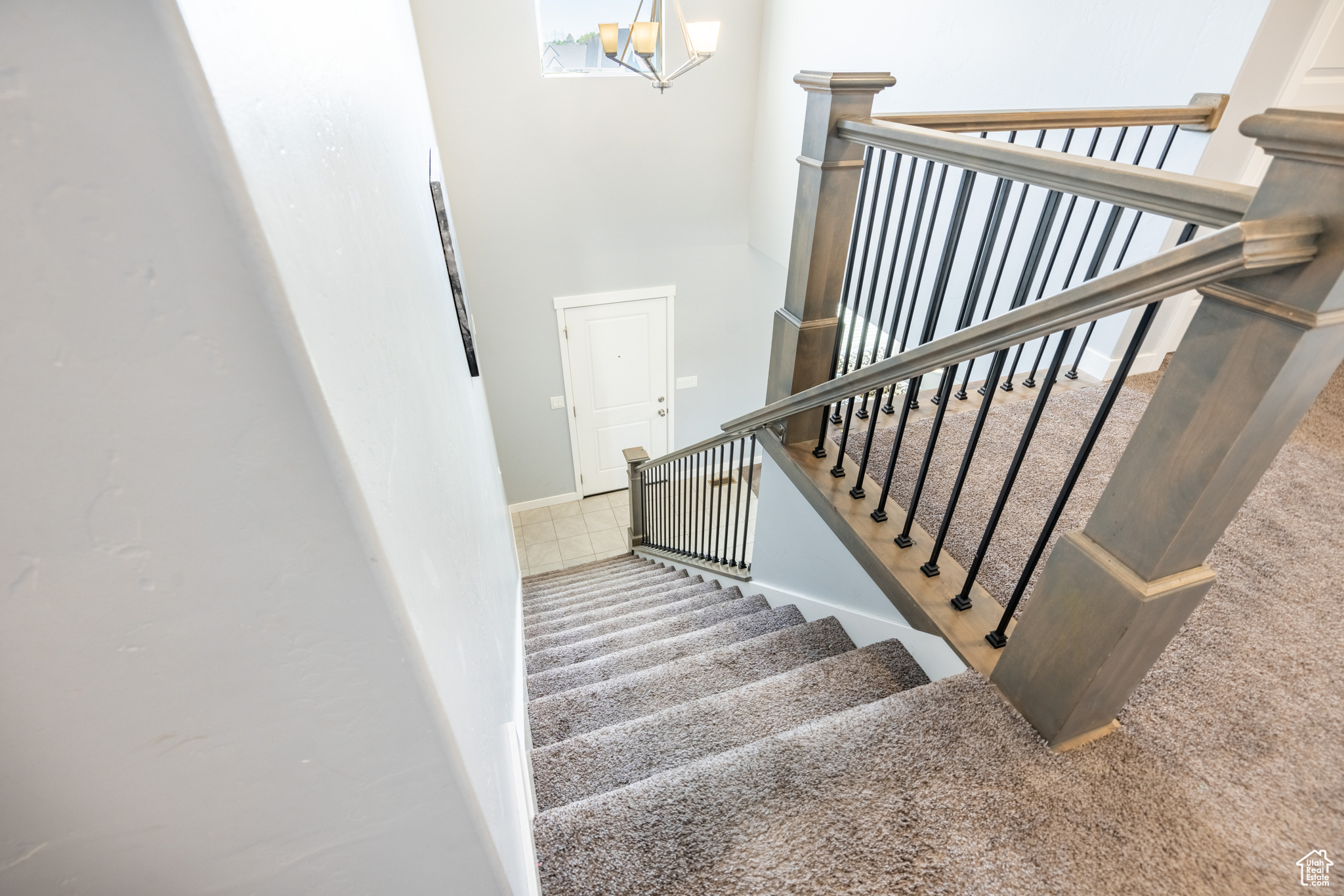 Stairway with a notable chandelier