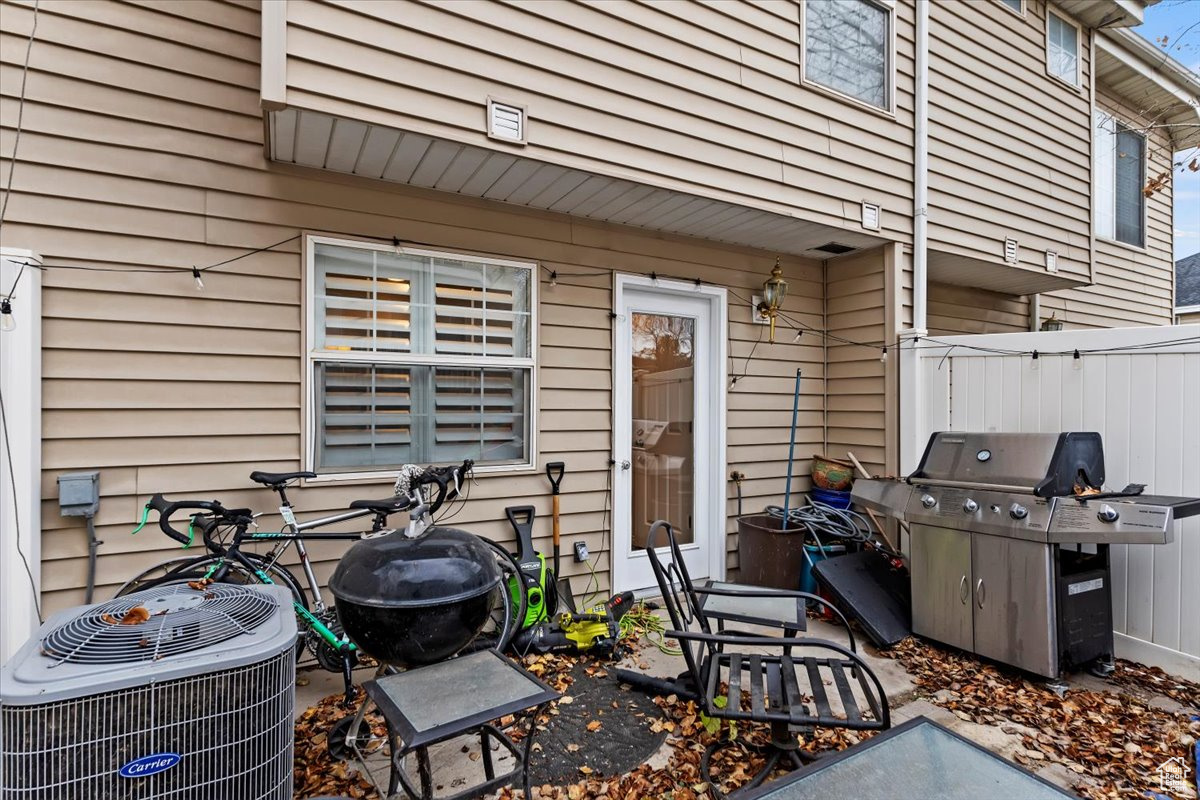 View of patio / terrace with cooling unit and a grill