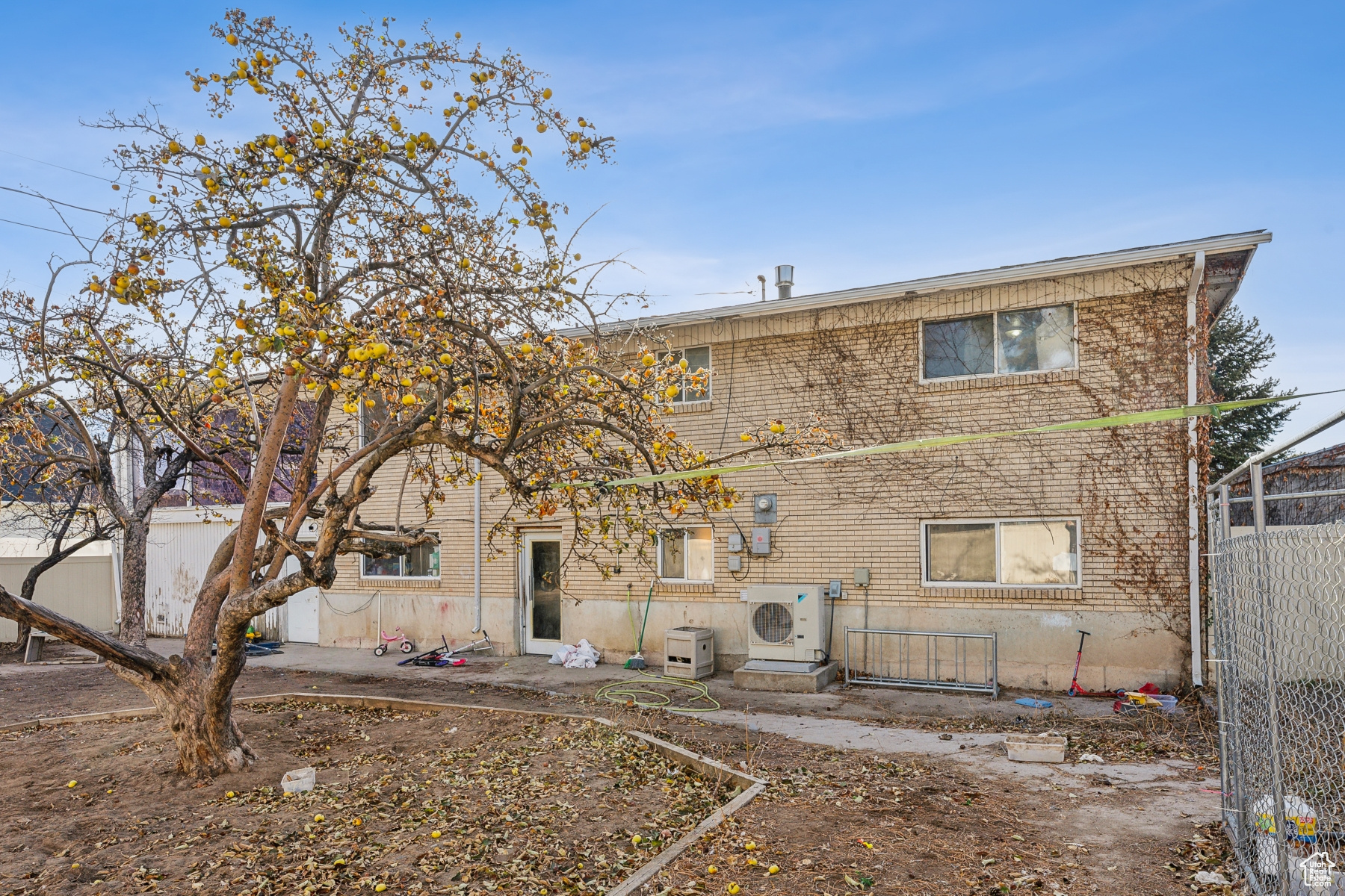 Rear view of property with ac unit