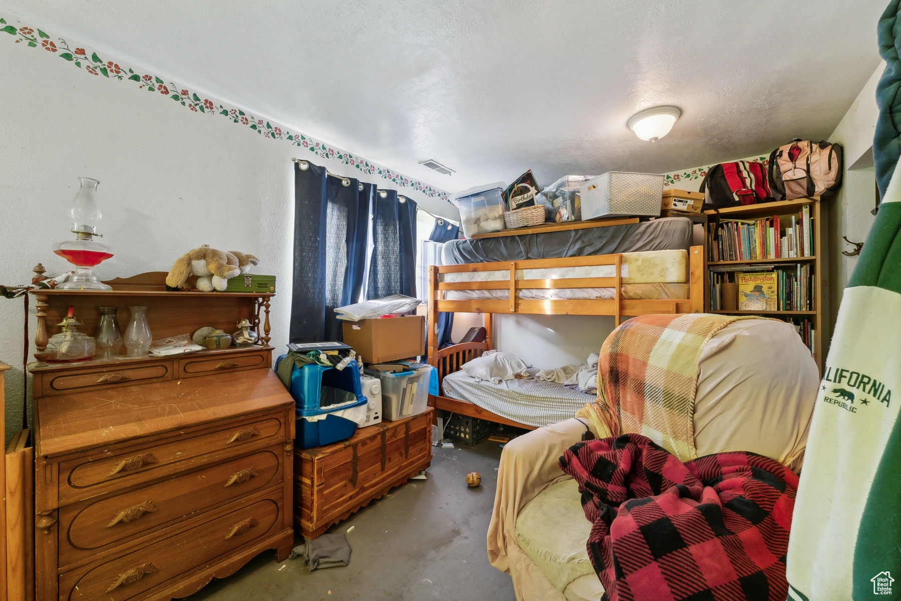 Bedroom with concrete flooring