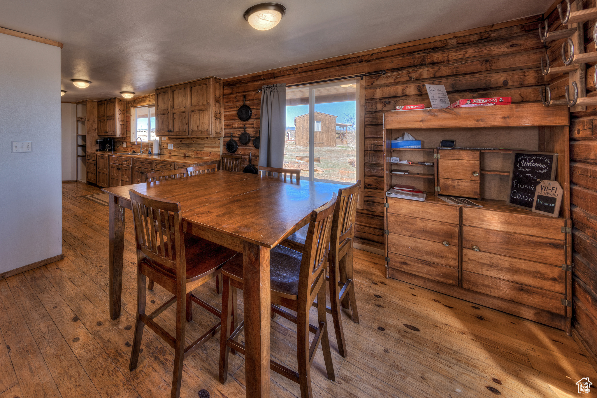 Dining area with light wood-type flooring and sink