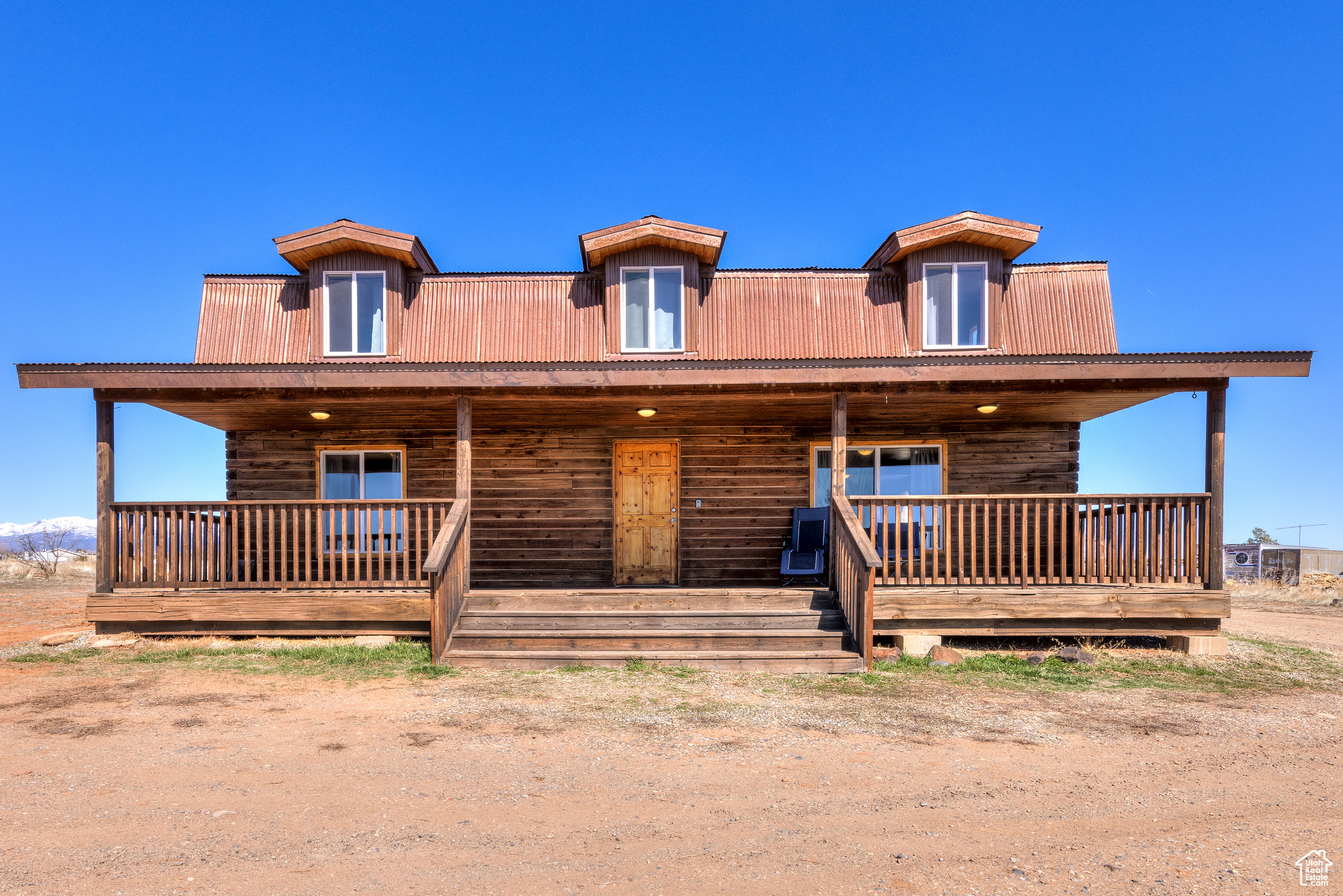 Cabin featuring covered porch