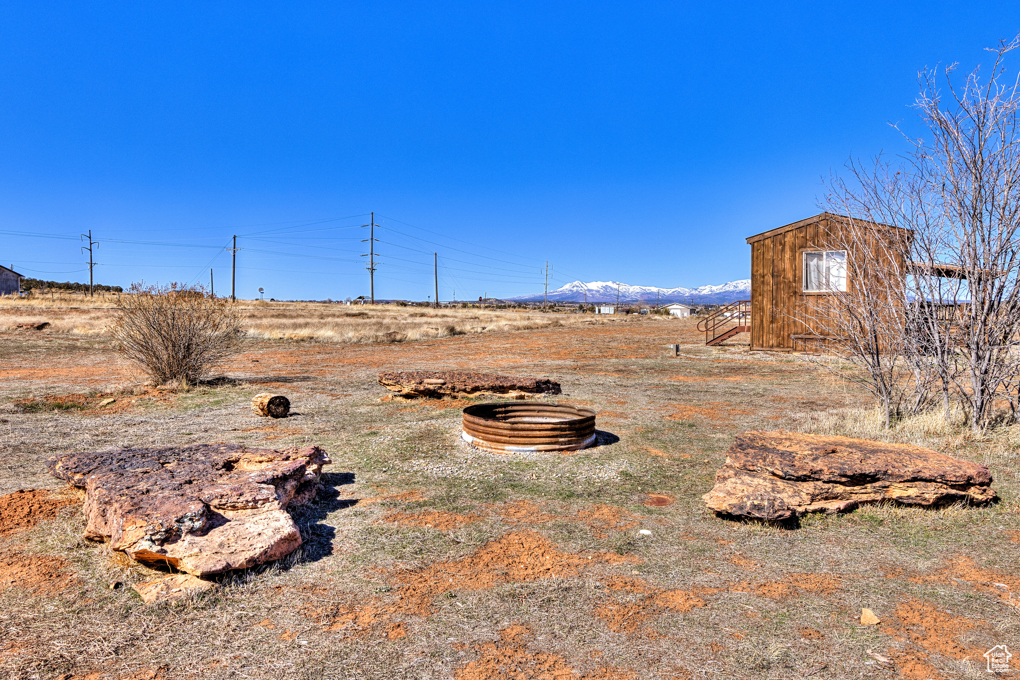 View of yard with a rural view