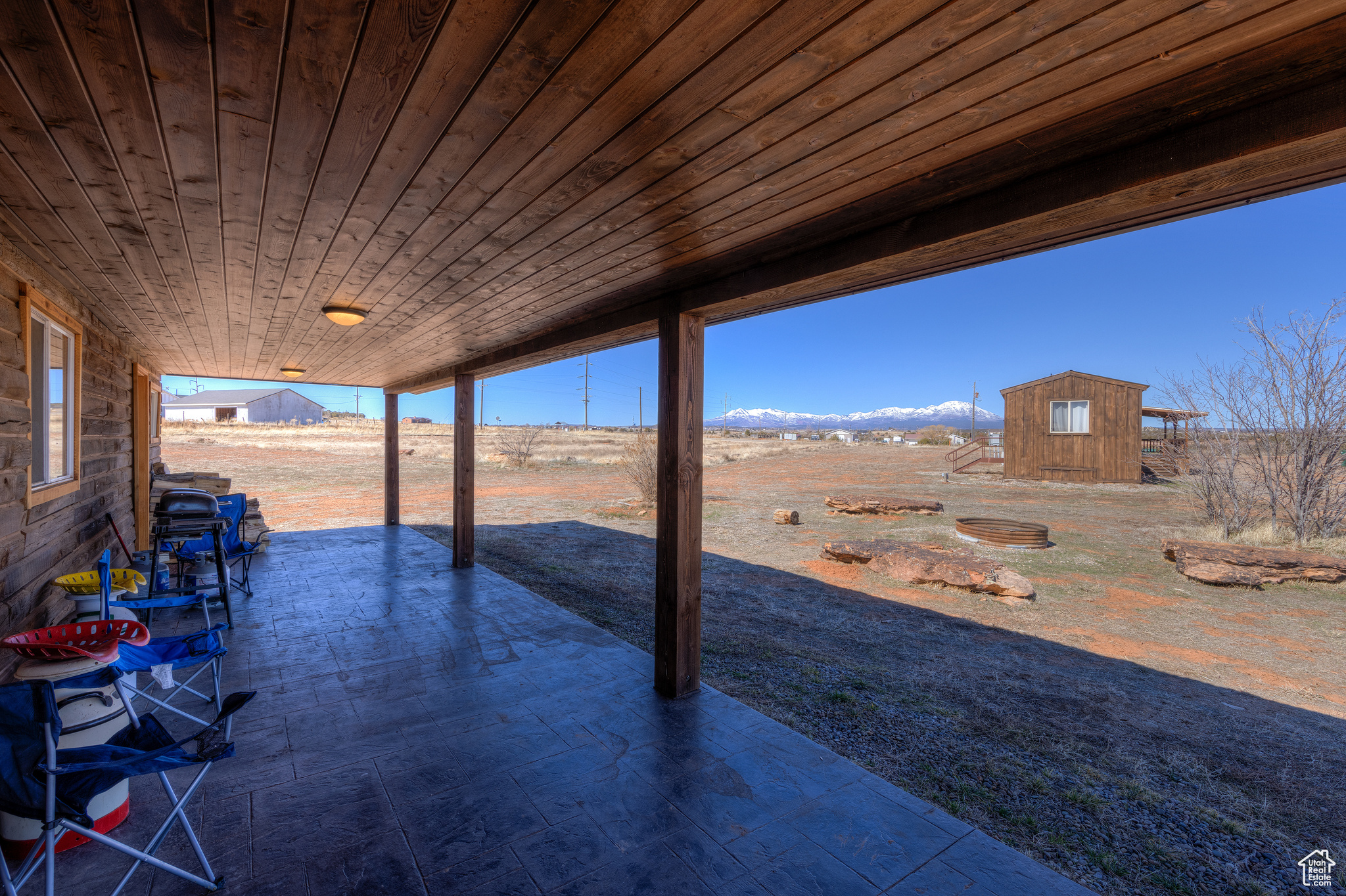 View of patio / terrace with a mountain view and a storage shed