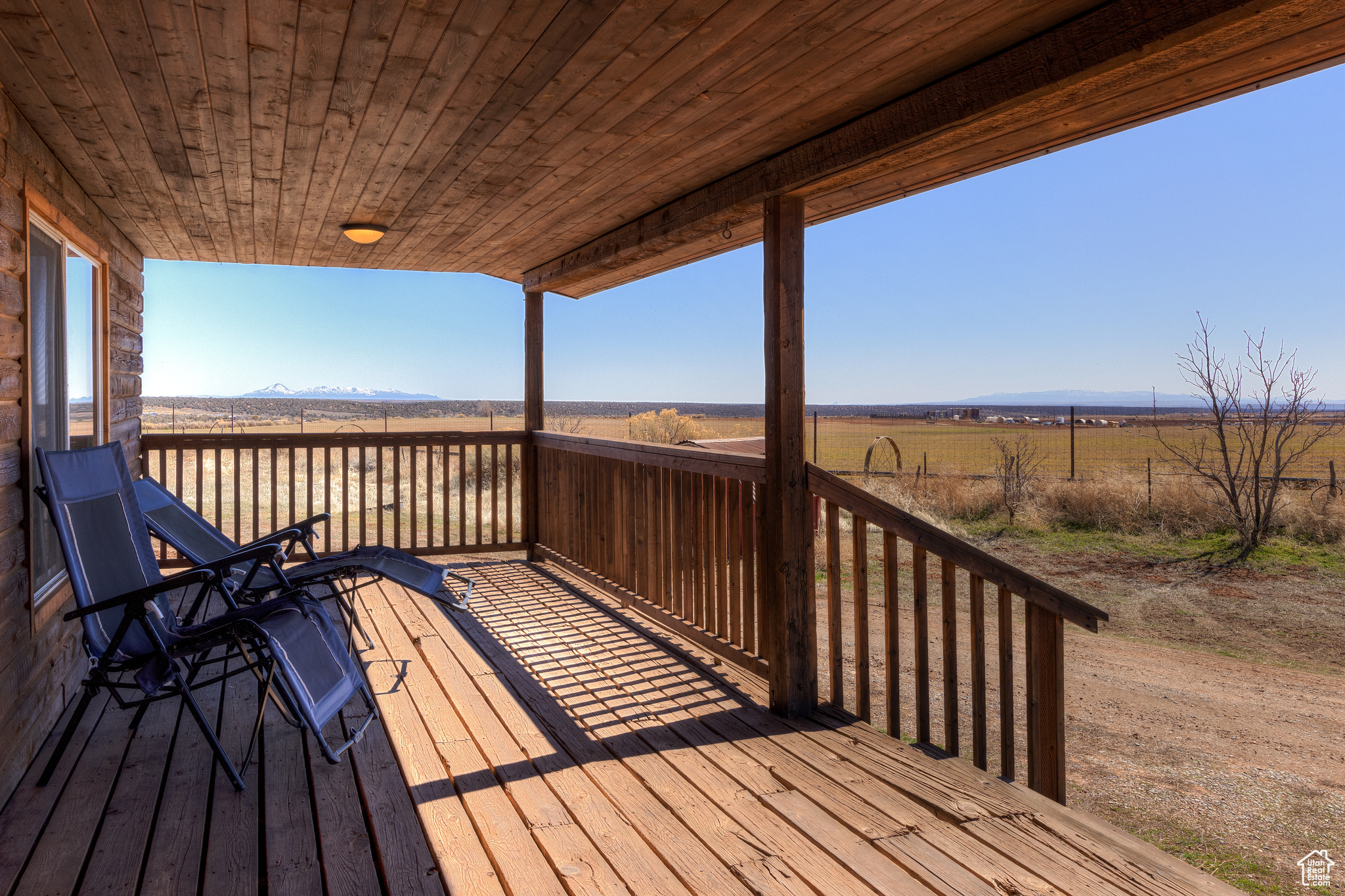 Wooden terrace featuring a rural view