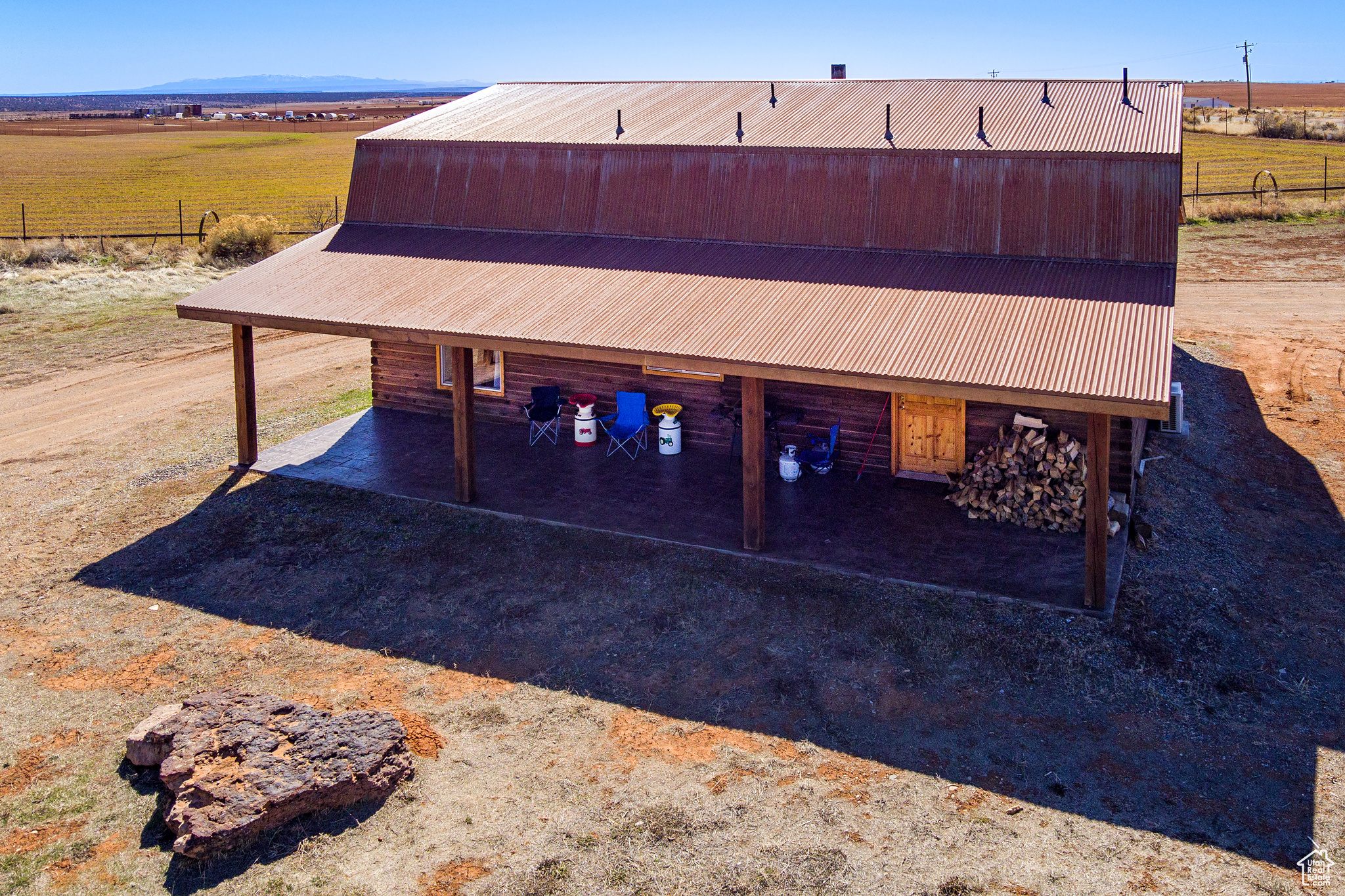 Exterior space with a mountain view, a rural view, and an outdoor structure