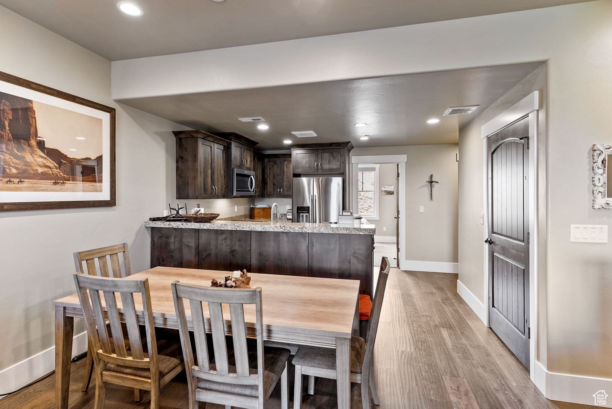 Dining room with light hardwood / wood-style floors