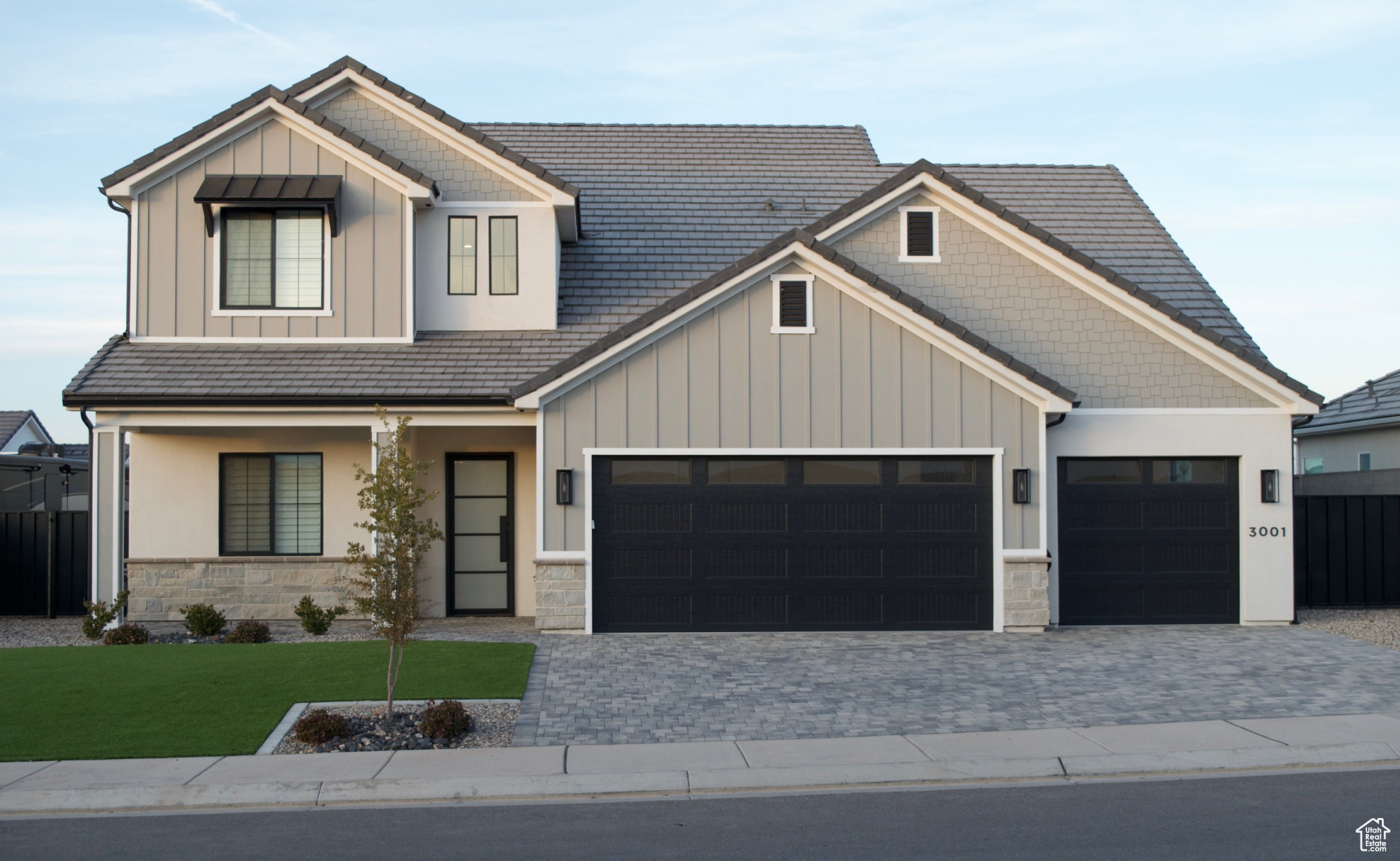 Craftsman-style house featuring a garage and a front yard