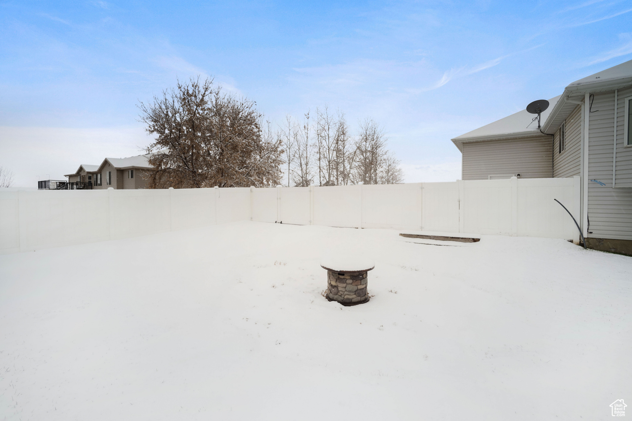 View of yard covered in snow