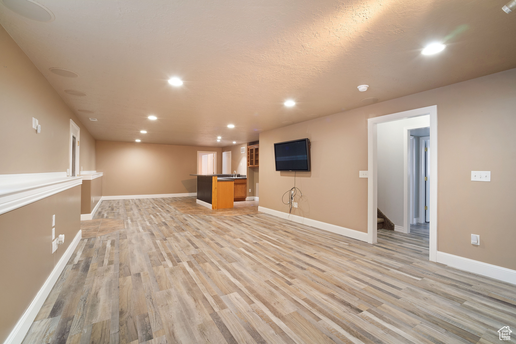 Unfurnished living room with light hardwood / wood-style floors