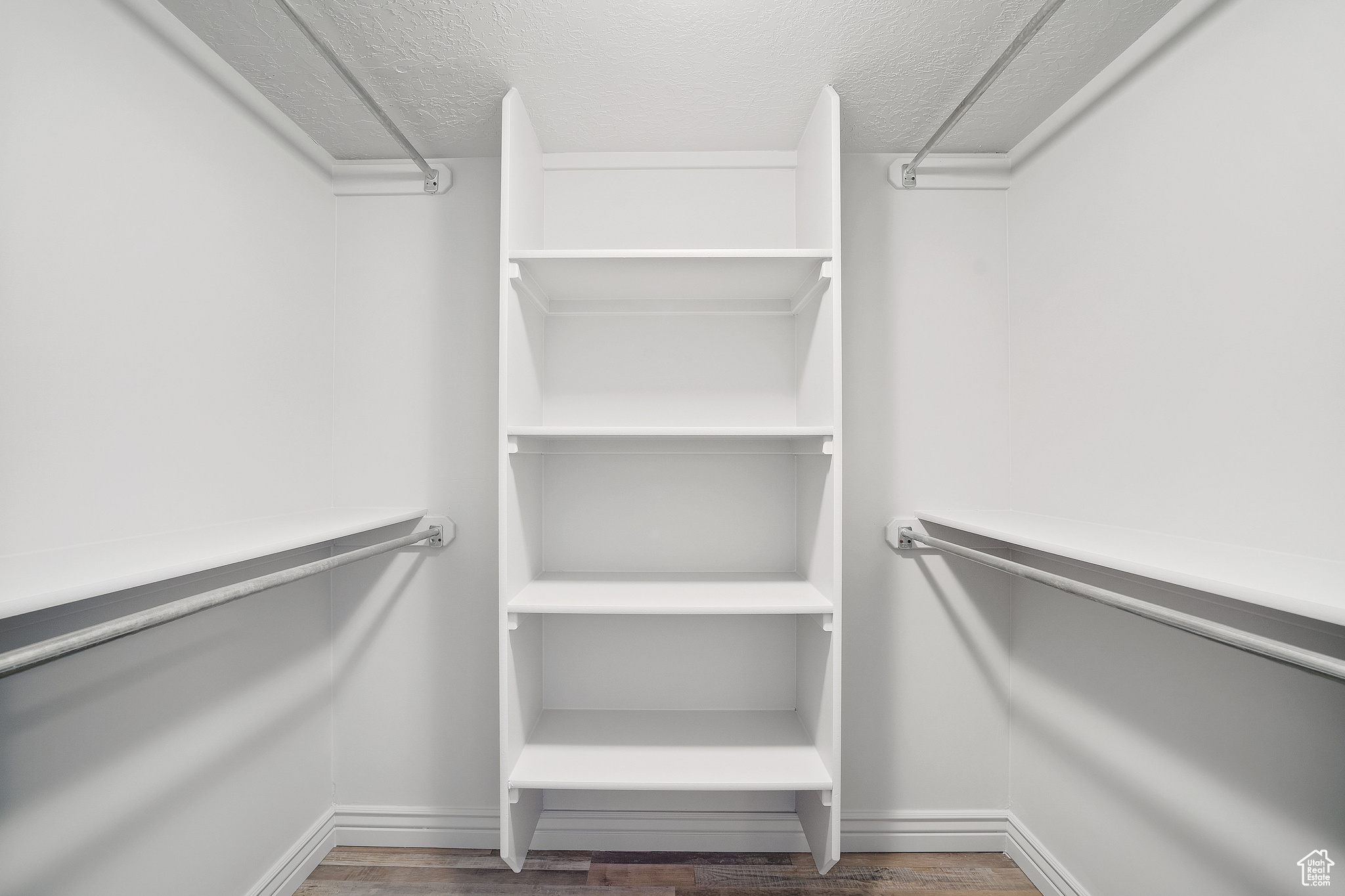 Walk in closet featuring hardwood / wood-style flooring