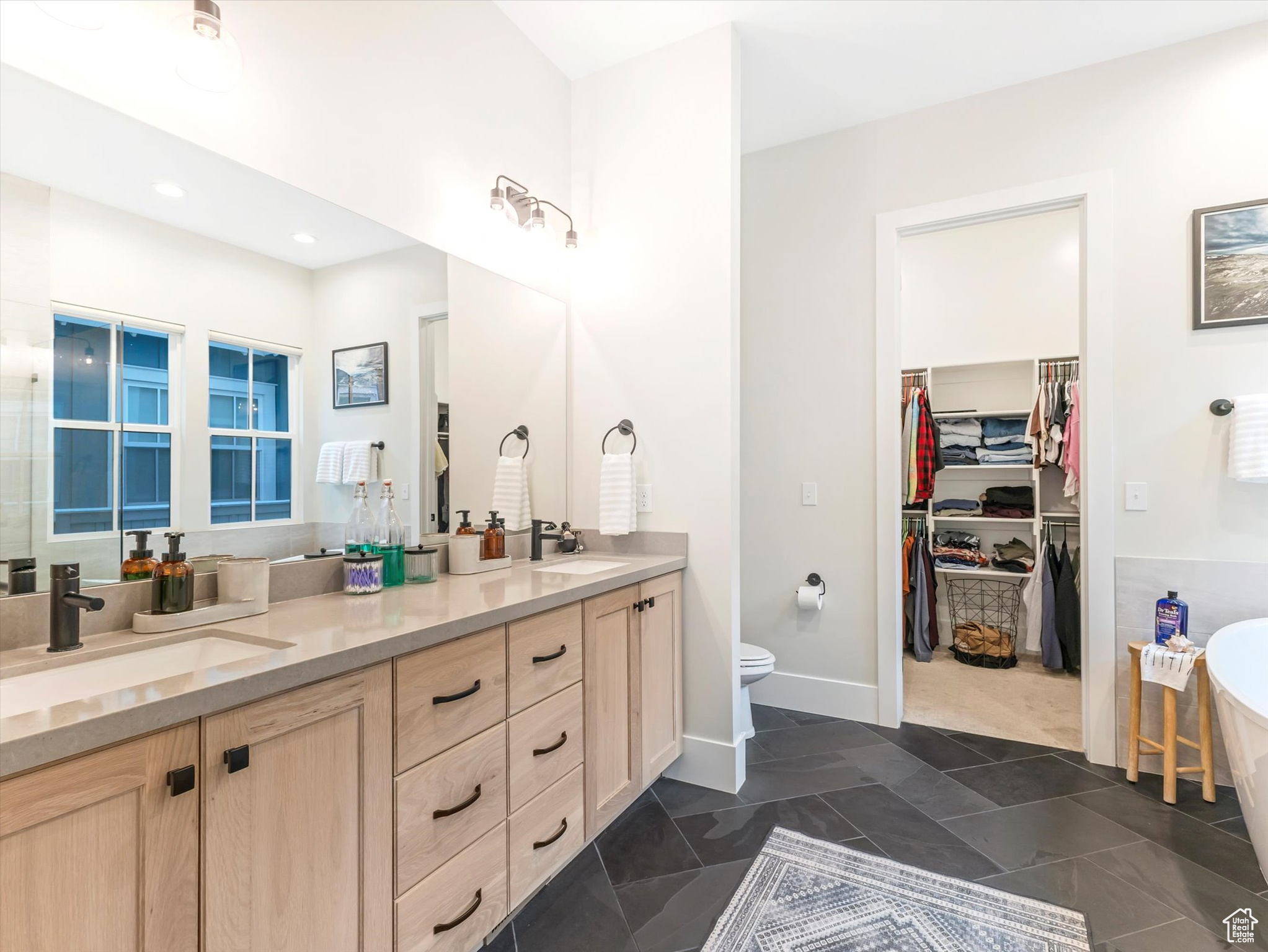 Bathroom featuring a bathtub and vanity