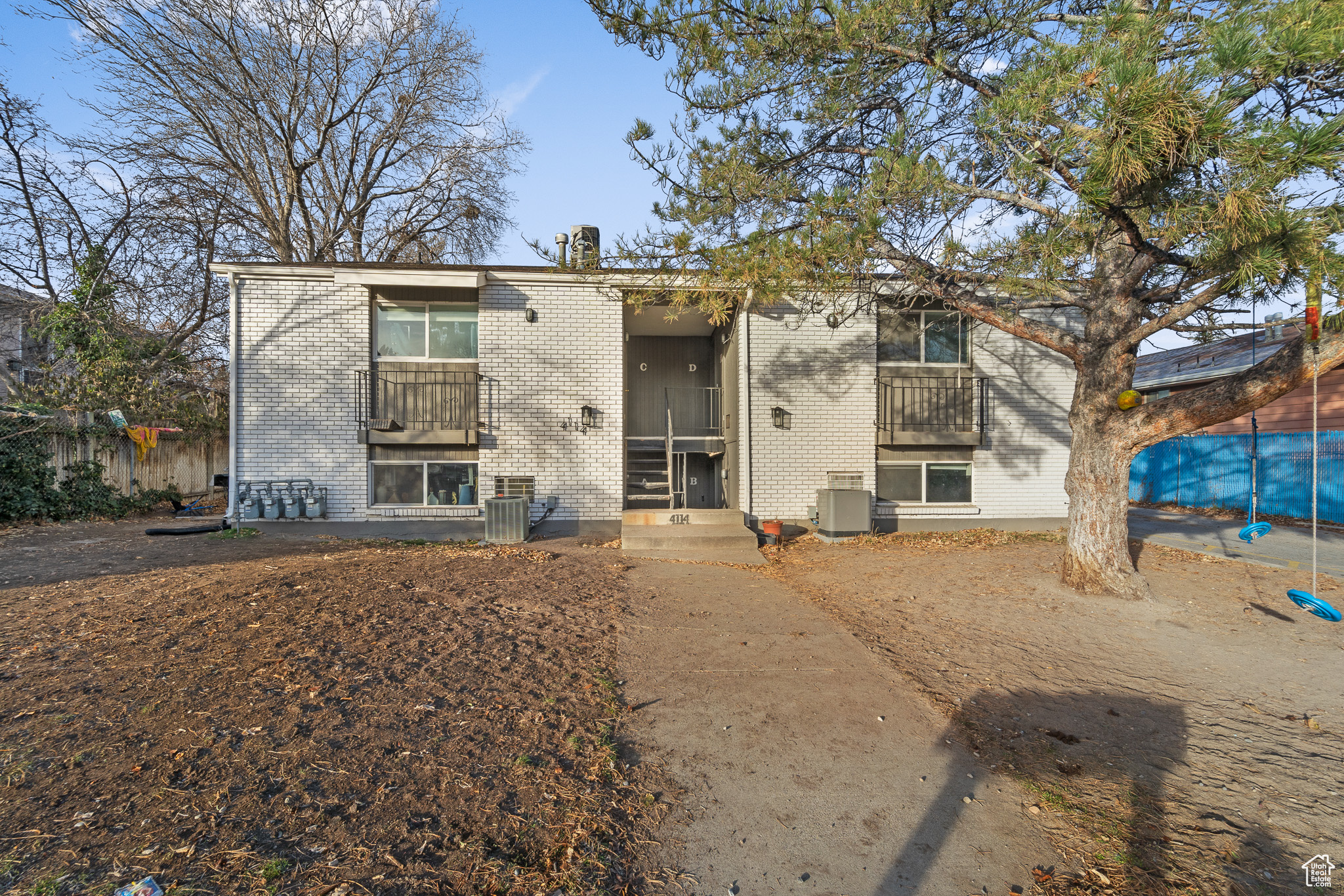 View of front of house with central AC