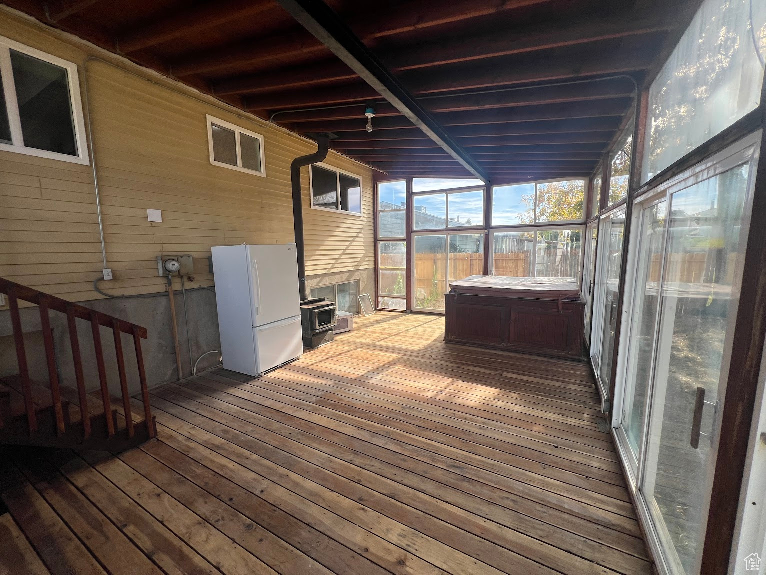 Wooden terrace with a hot tub