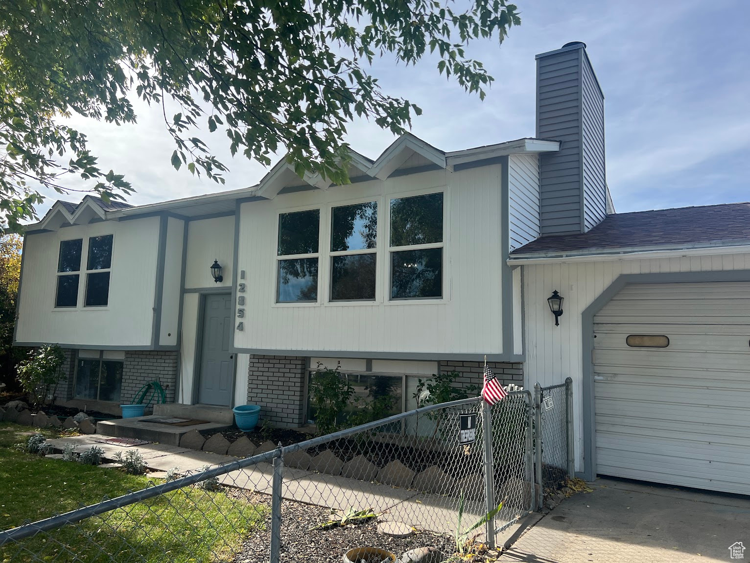 View of front of property featuring a garage