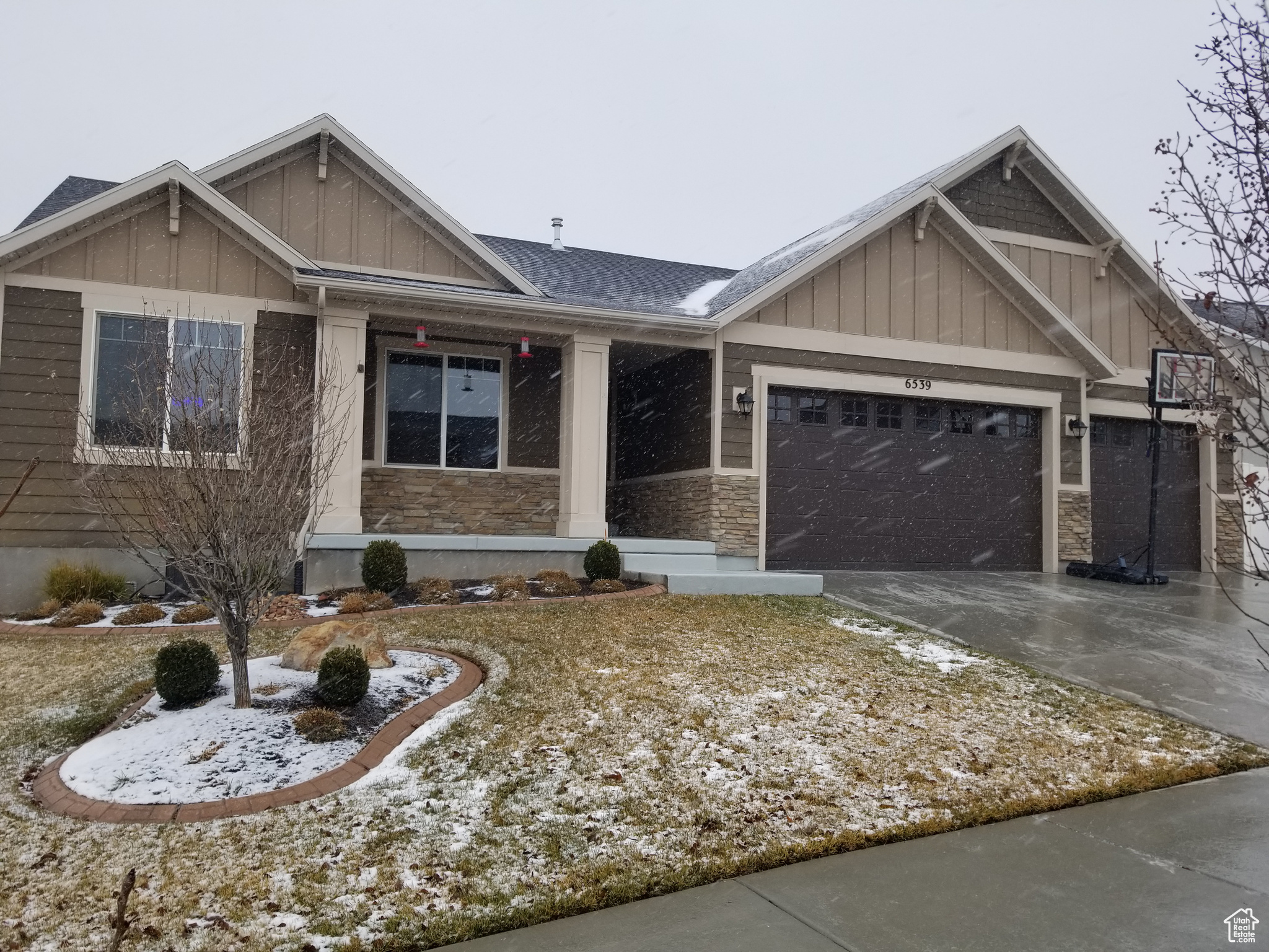 View of front of property with a 3-car garage