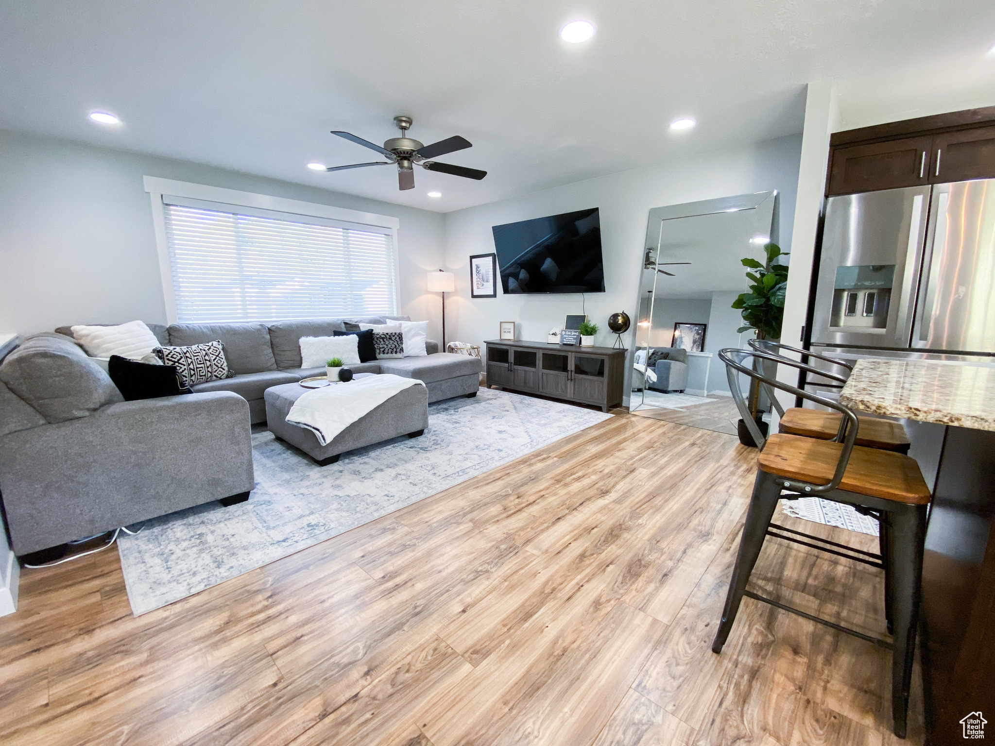 Upstairs Living room featuring ceiling fan and light wood-type flooring