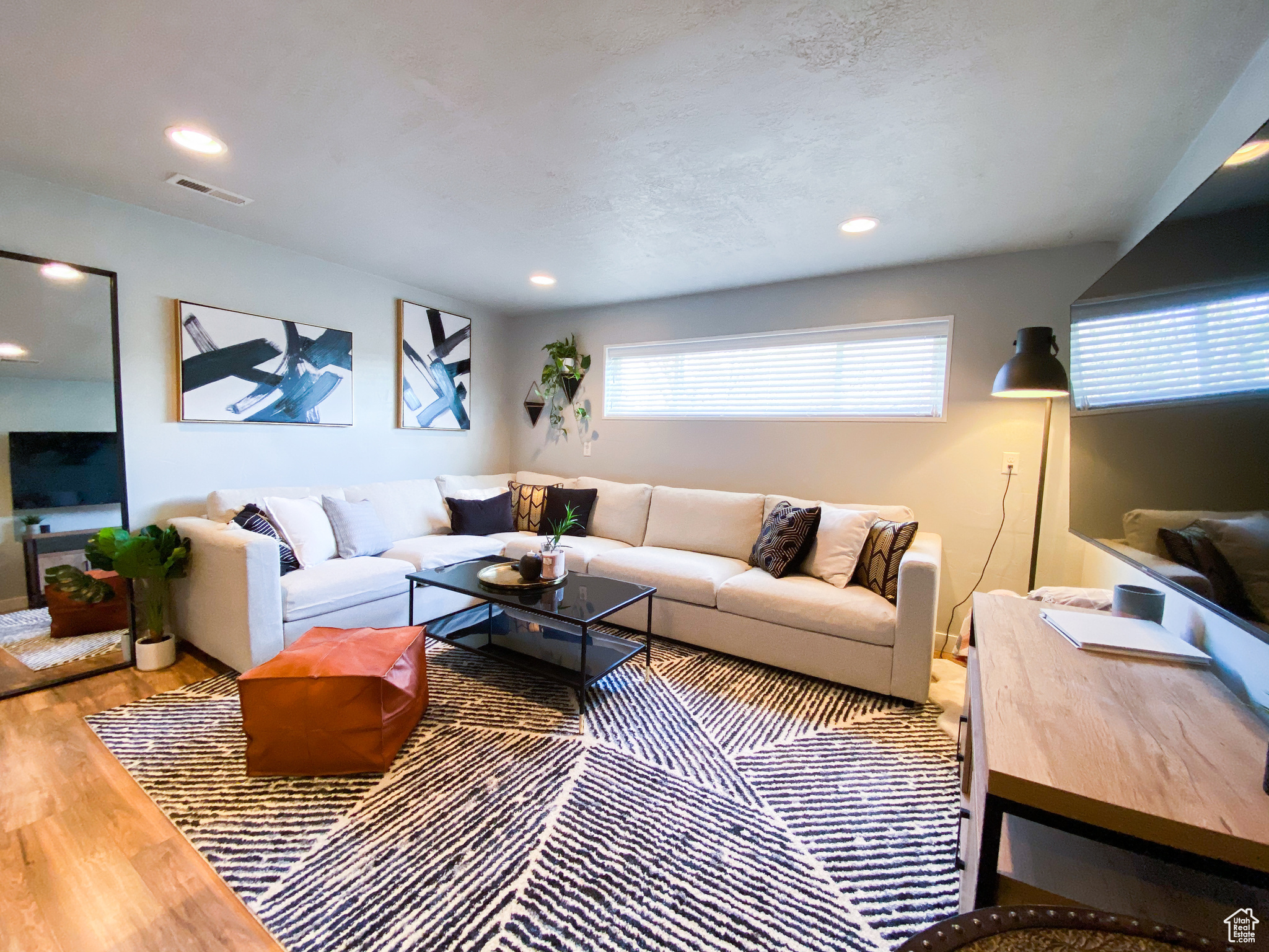 Downstairs Living room with hardwood / wood-style floors