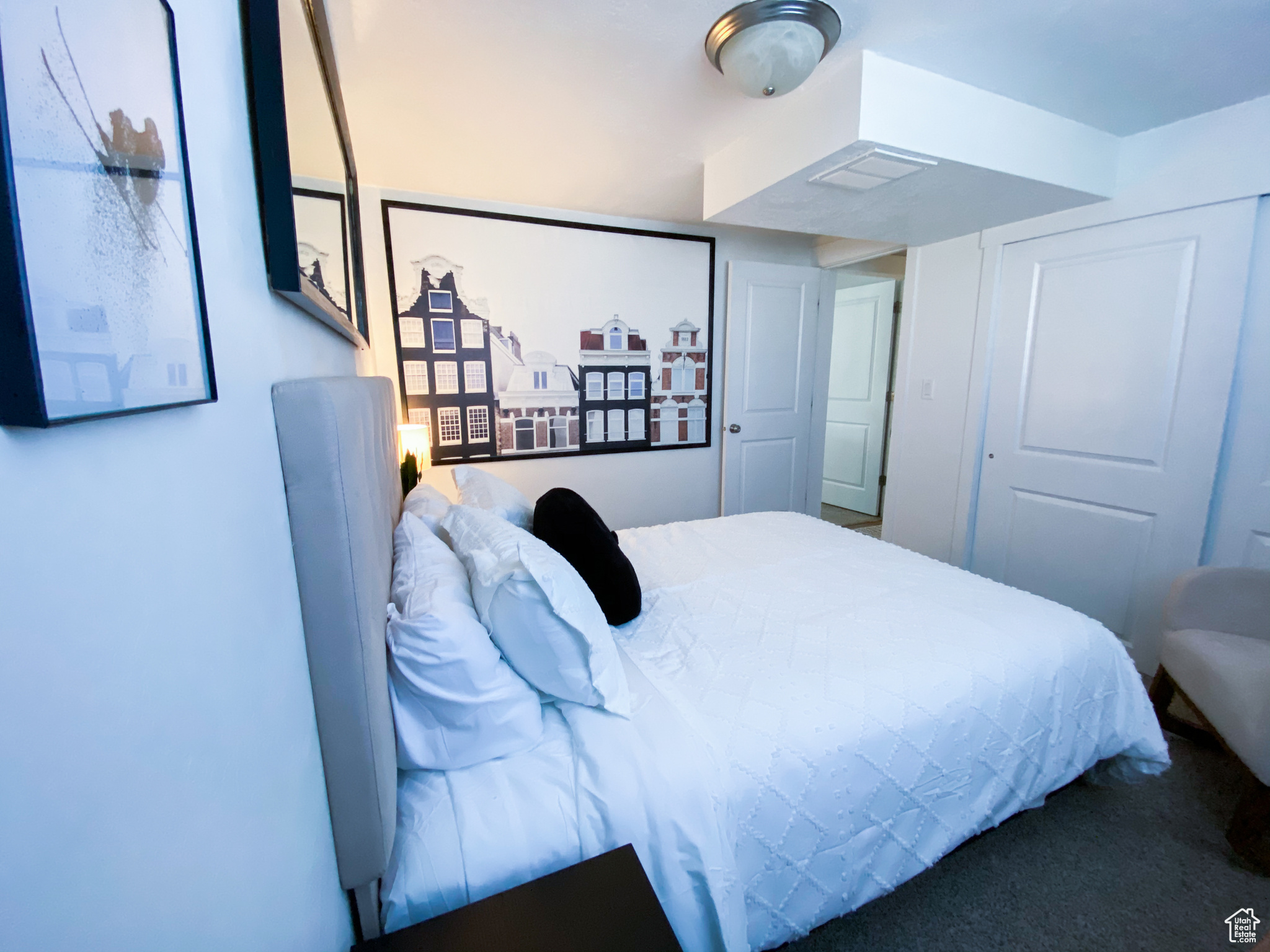 Downstairs Queen Bedroom featuring carpet flooring