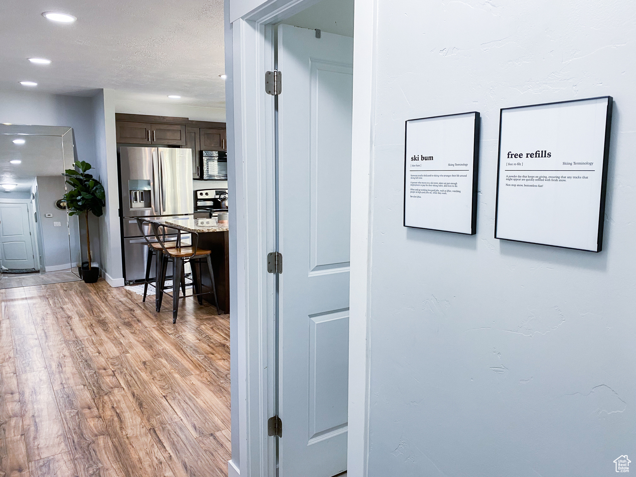 Upstairs Corridor to Bathroom/Kitchen featuring light wood-type flooring