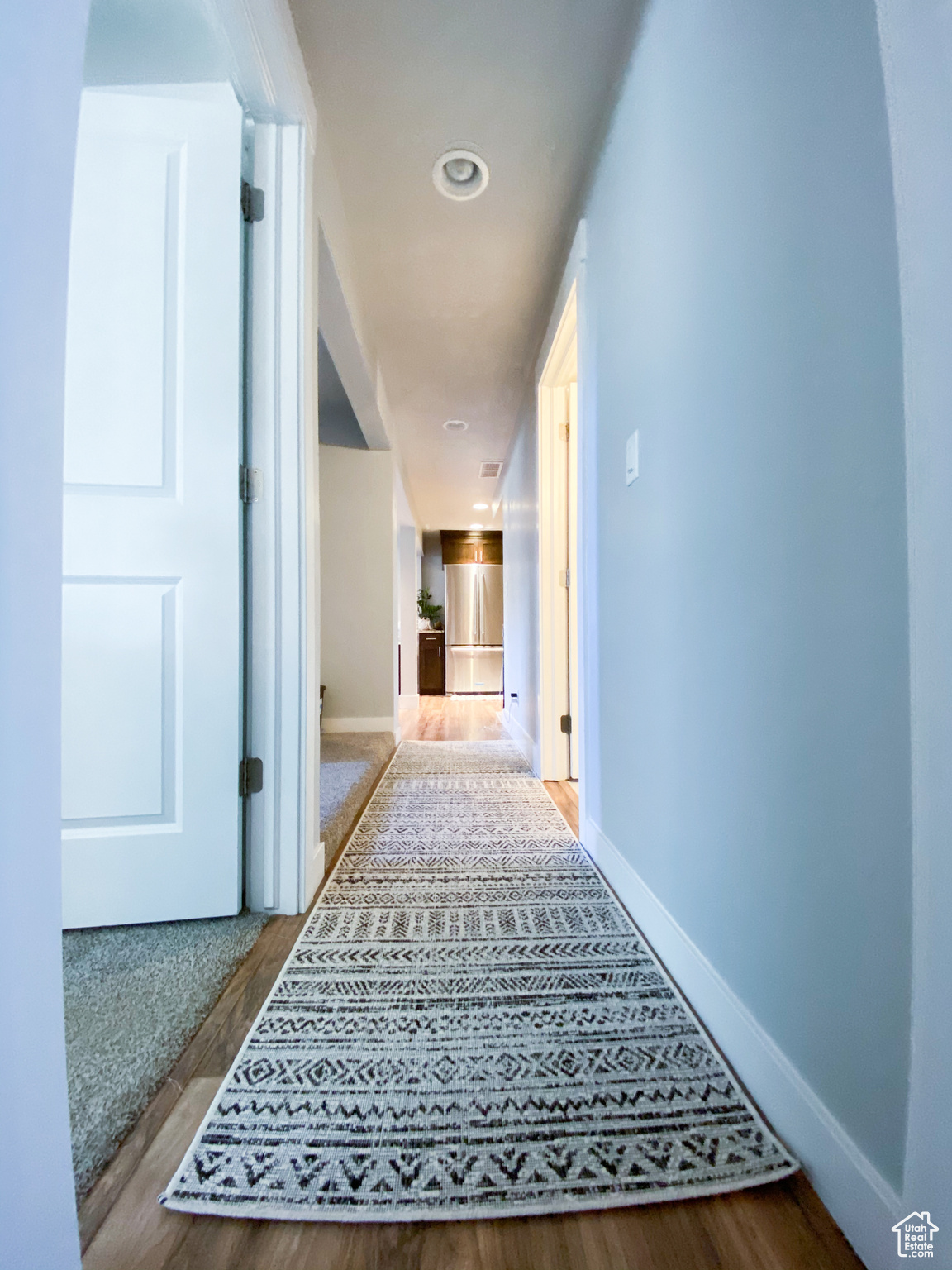 Hall featuring hardwood / wood-style floors