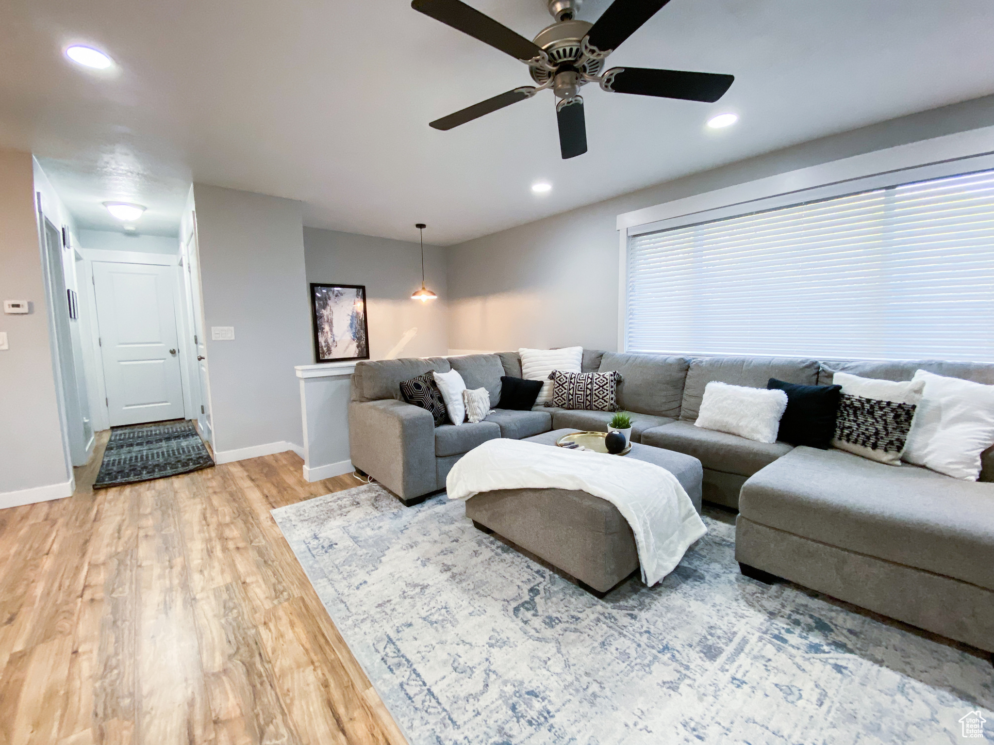 Upstairs Living room featuring ceiling fan and wood-type flooring