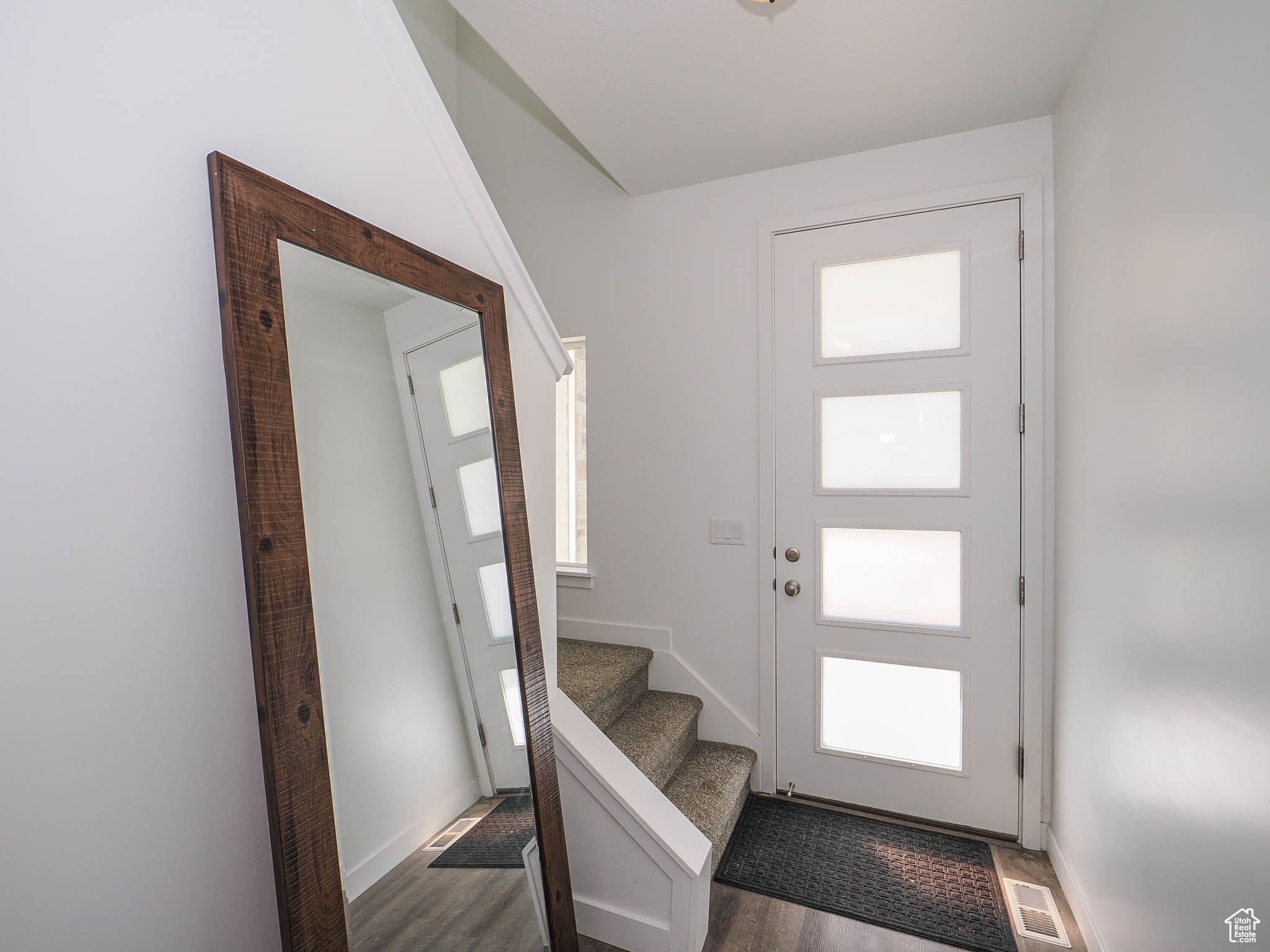 Entrance foyer featuring dark hardwood / wood-style flooring