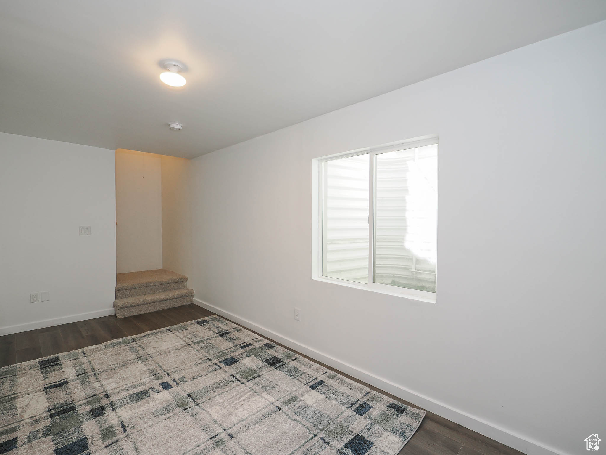 Unfurnished room with hardwood / wood-style floors