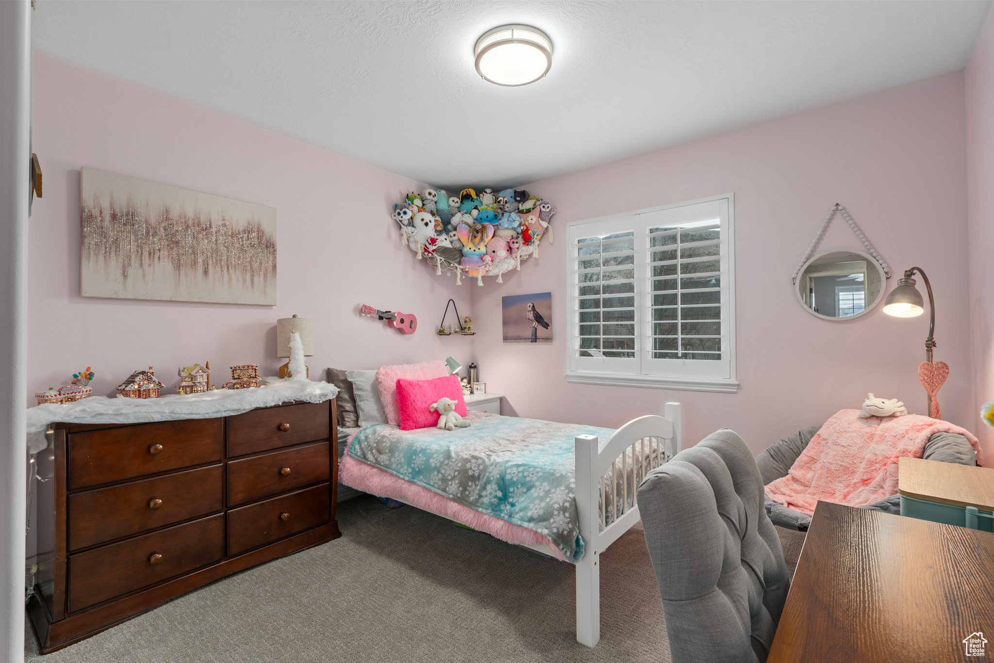 Bedroom featuring light colored carpet