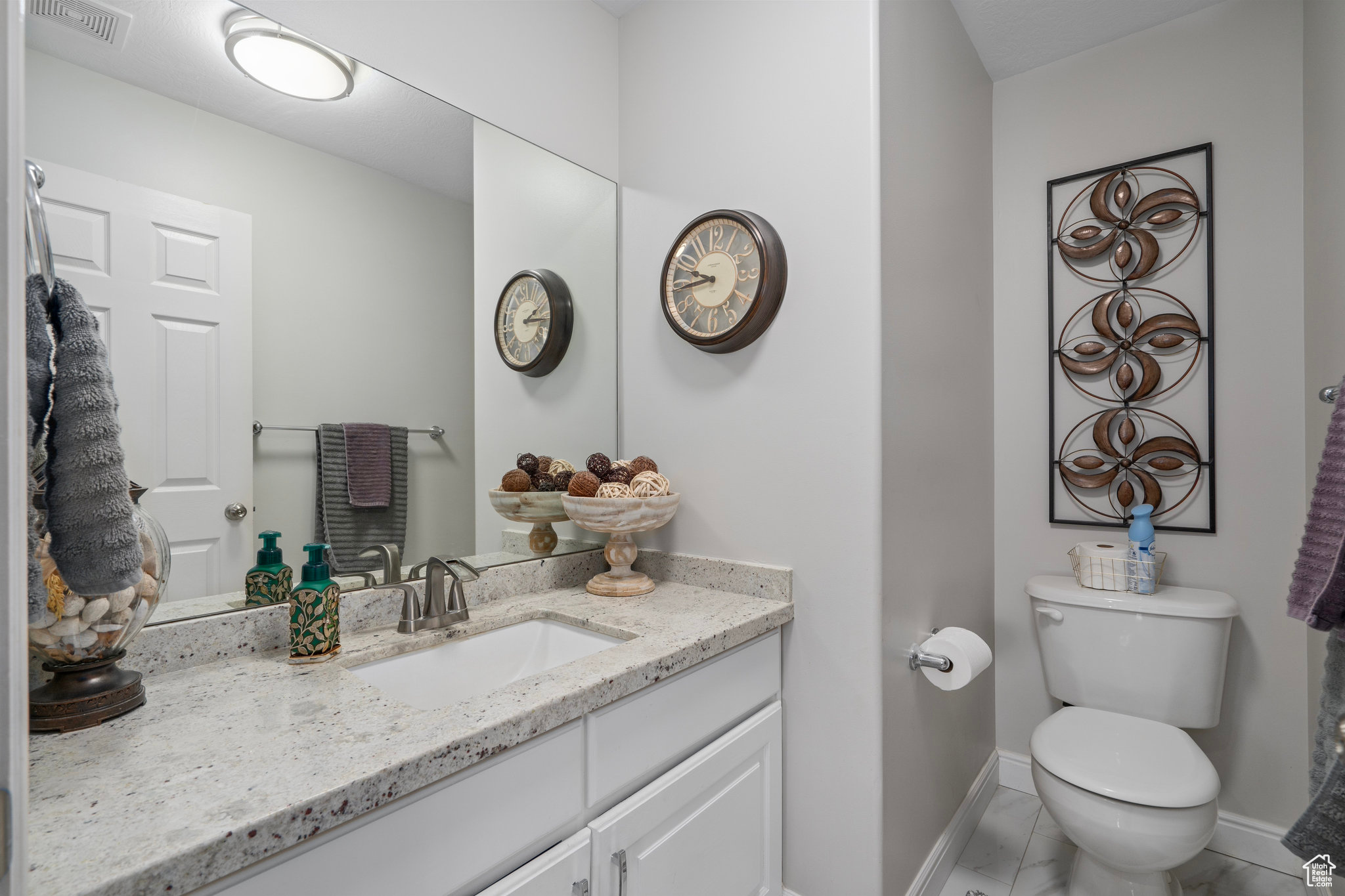 Bathroom with vanity and toilet