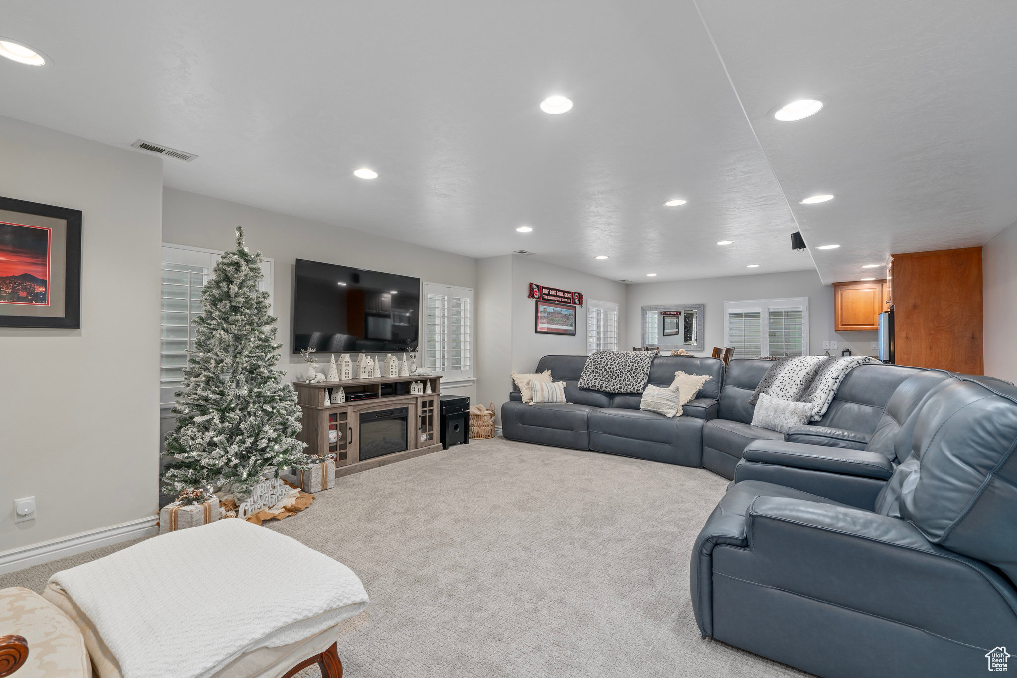 Living room with carpet flooring and a fireplace