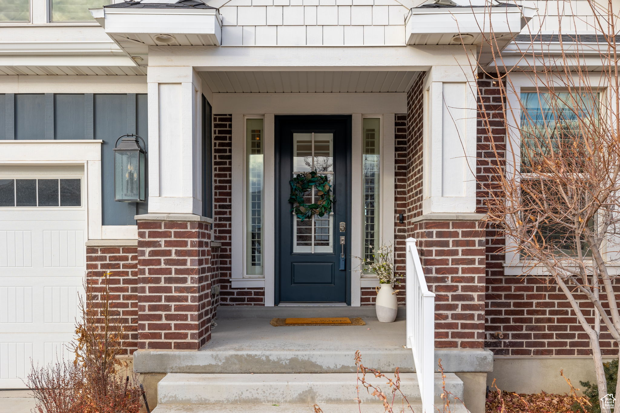 View of exterior entry featuring a garage