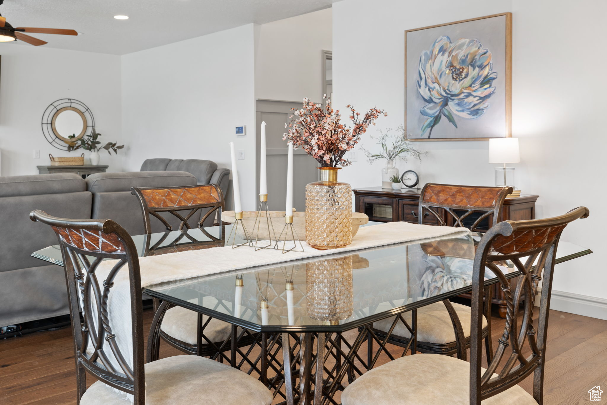 Dining space featuring ceiling fan and wood-type flooring